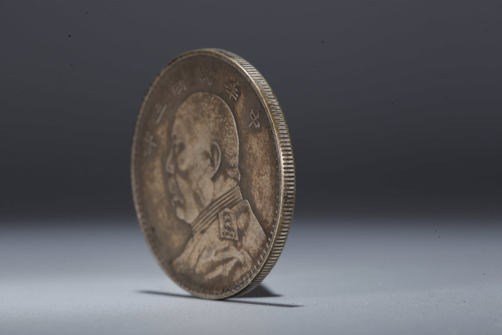 A SILVER DOLLAR COIN - 2