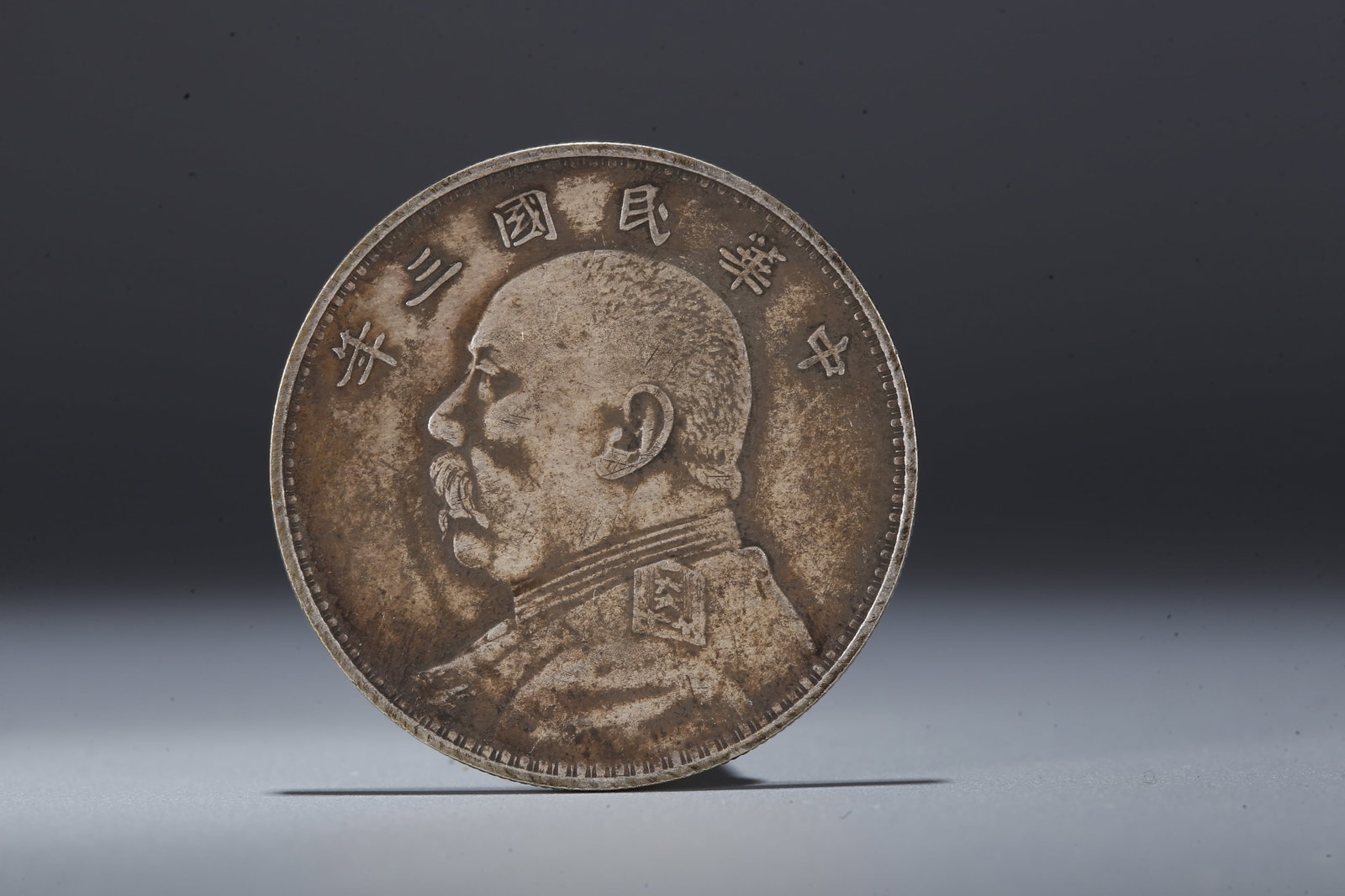 A SILVER DOLLAR COIN - 3
