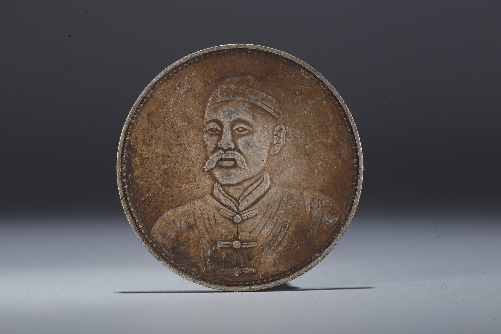 A SILVER DOLLAR COIN - 3
