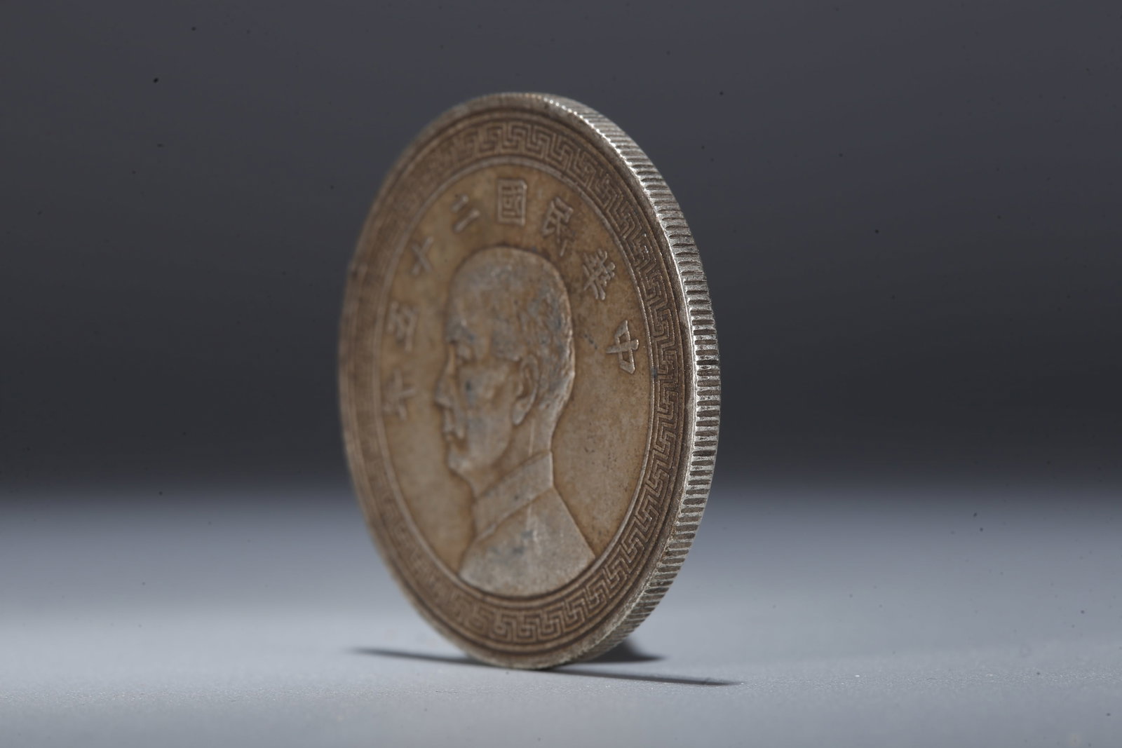 A SILVER DOLLAR COIN - 2