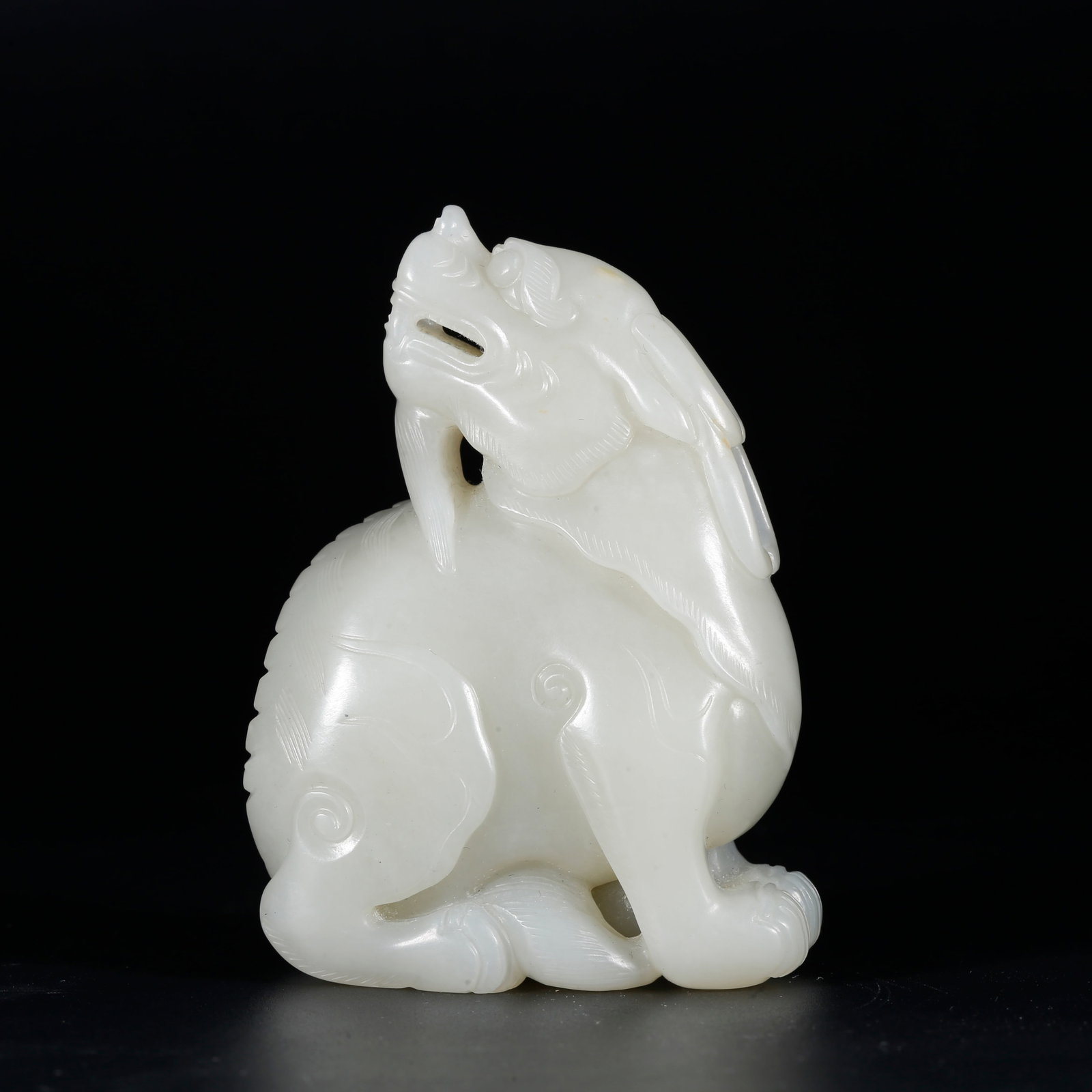 A HETIAN JADE BEAST ORNAMENT (1 of 9)