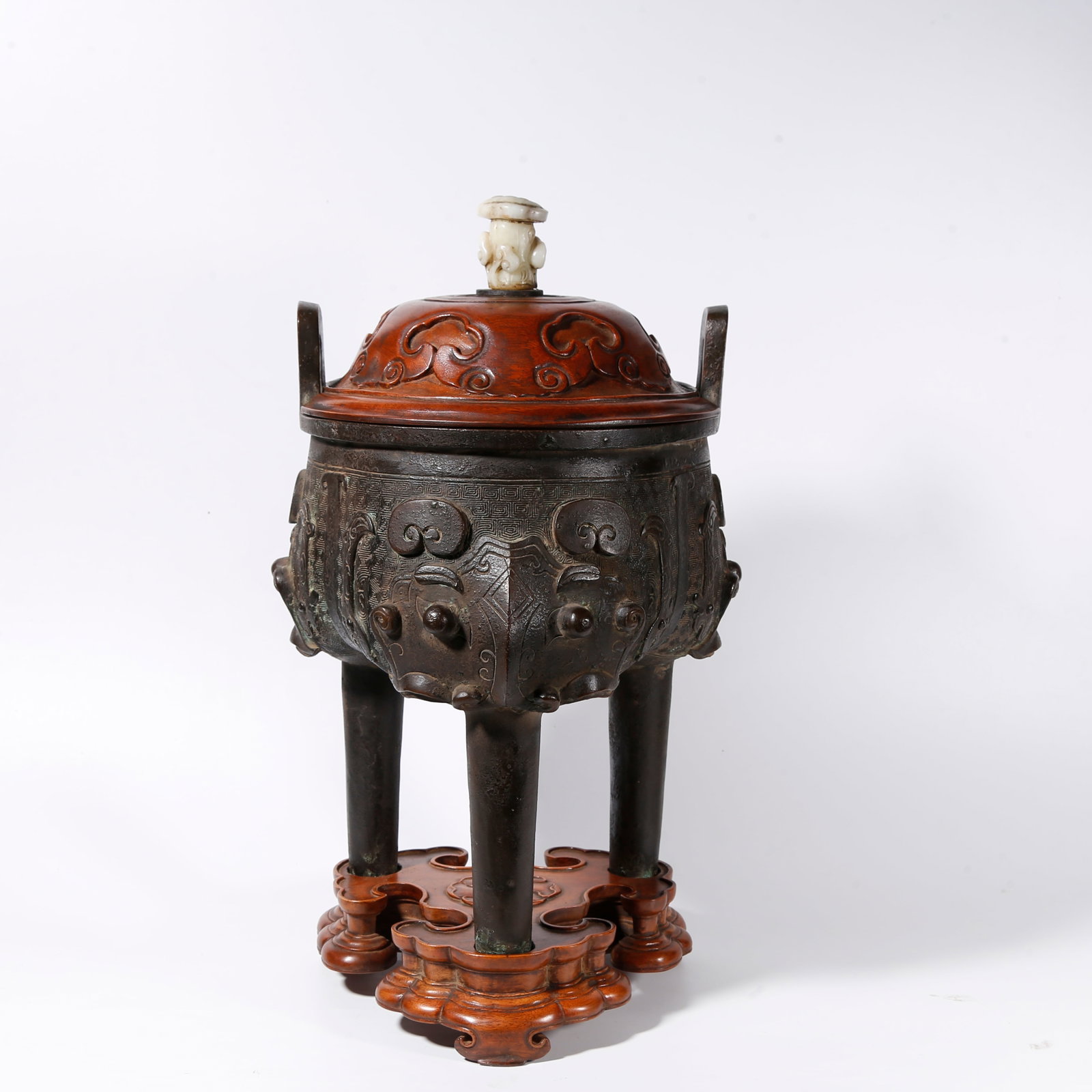 A BRONZE TRIPOD CENSER WITH BEAST MASK PATTERNS (1 of 11)
