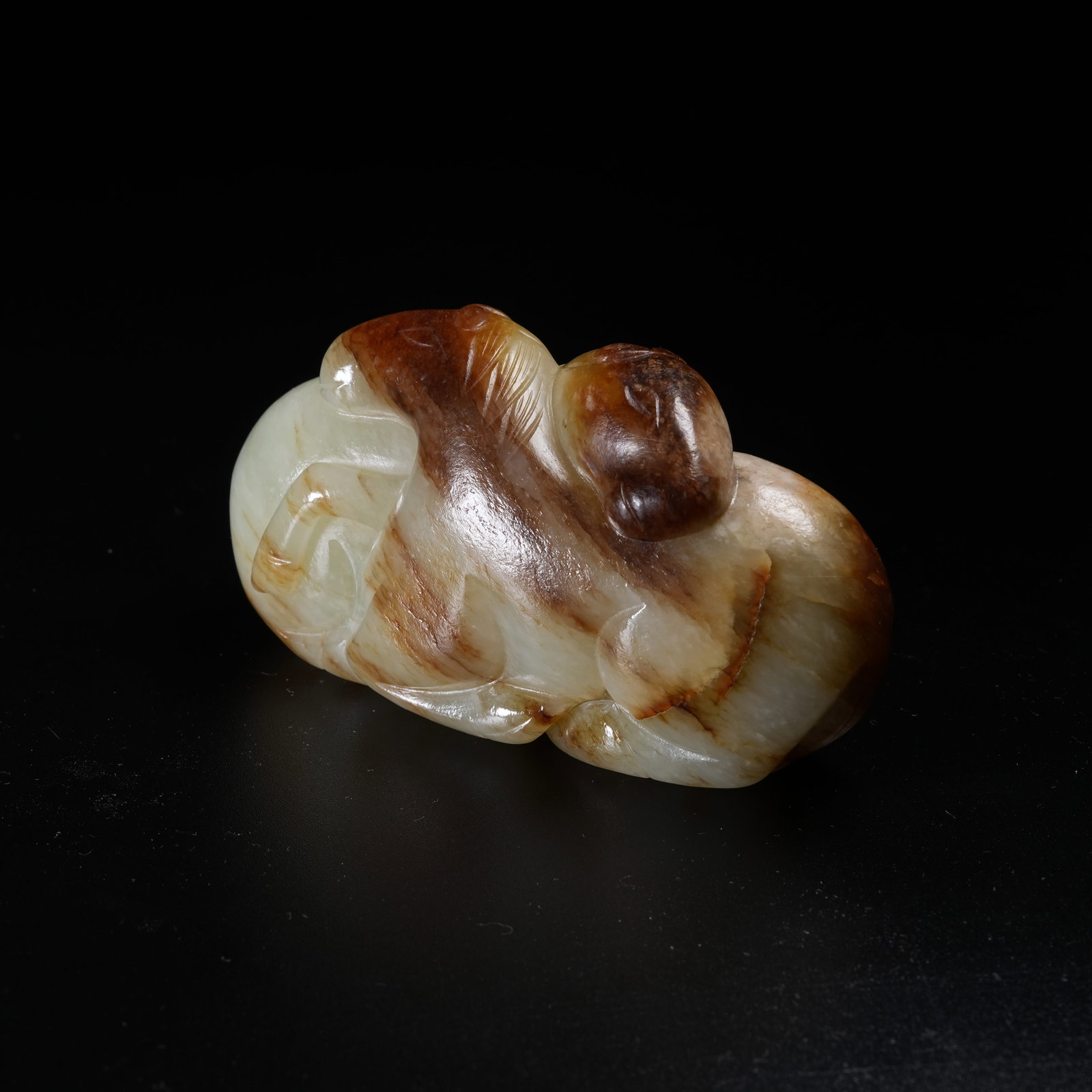 A ANCIENT JADE RECUMBENT HORSE ORNAMENT: Ancient Jade Recumbent Horse Ornament