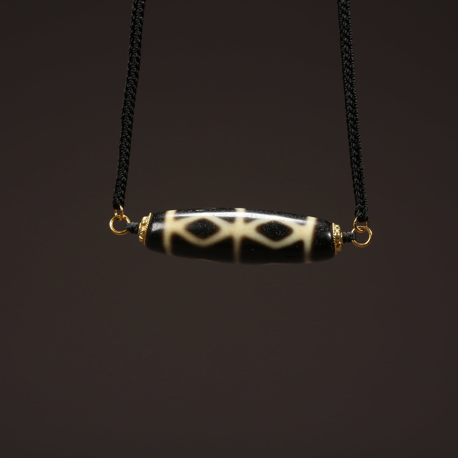 A STRAND OF AGATE DZI BEAD (1 of 8)