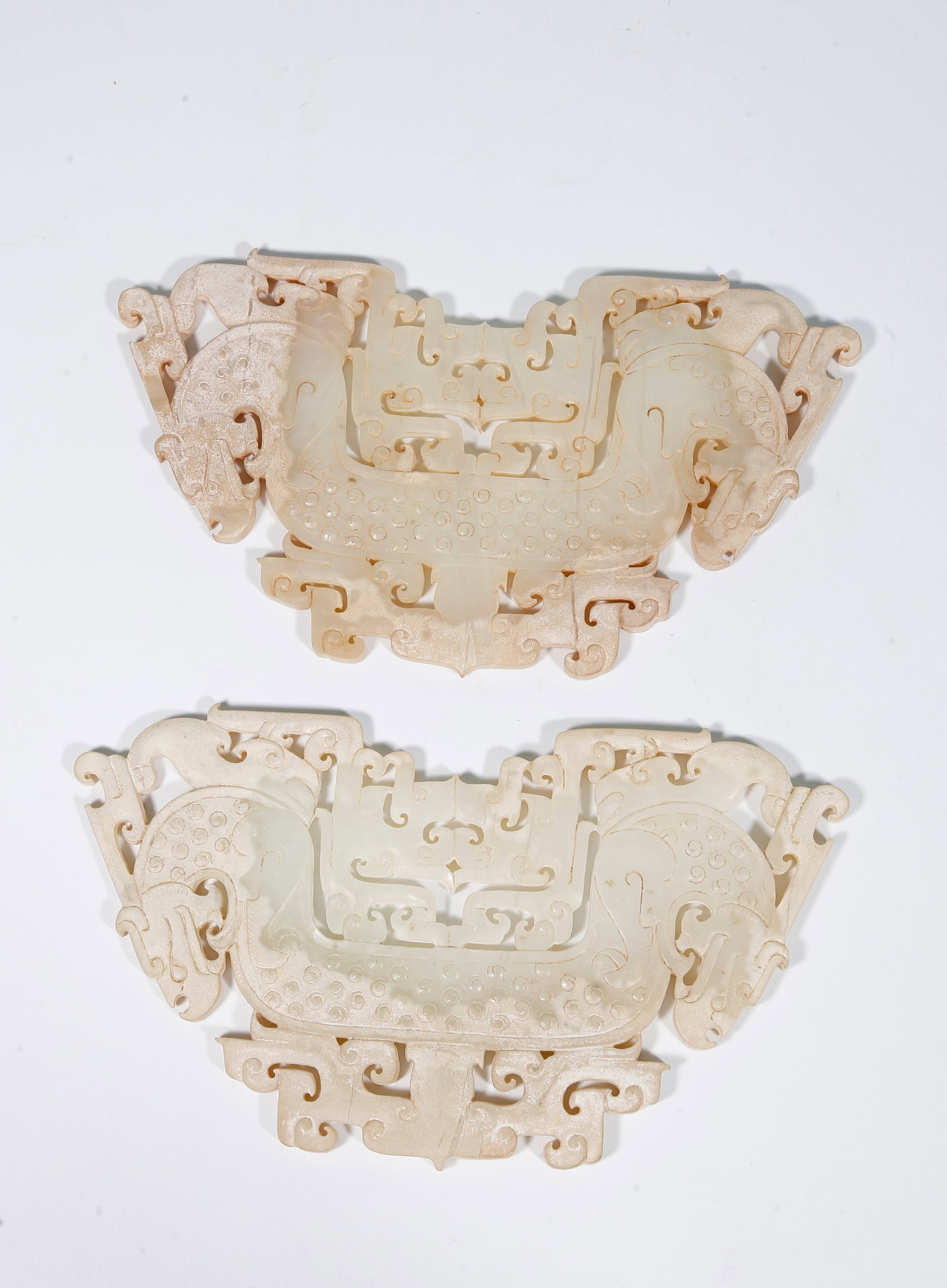 A ARCHAIC JADE DRAGON-SHAPED PENDANT (A PAIR): Archaic Jade Dragon-shaped Pendant (A Pair)