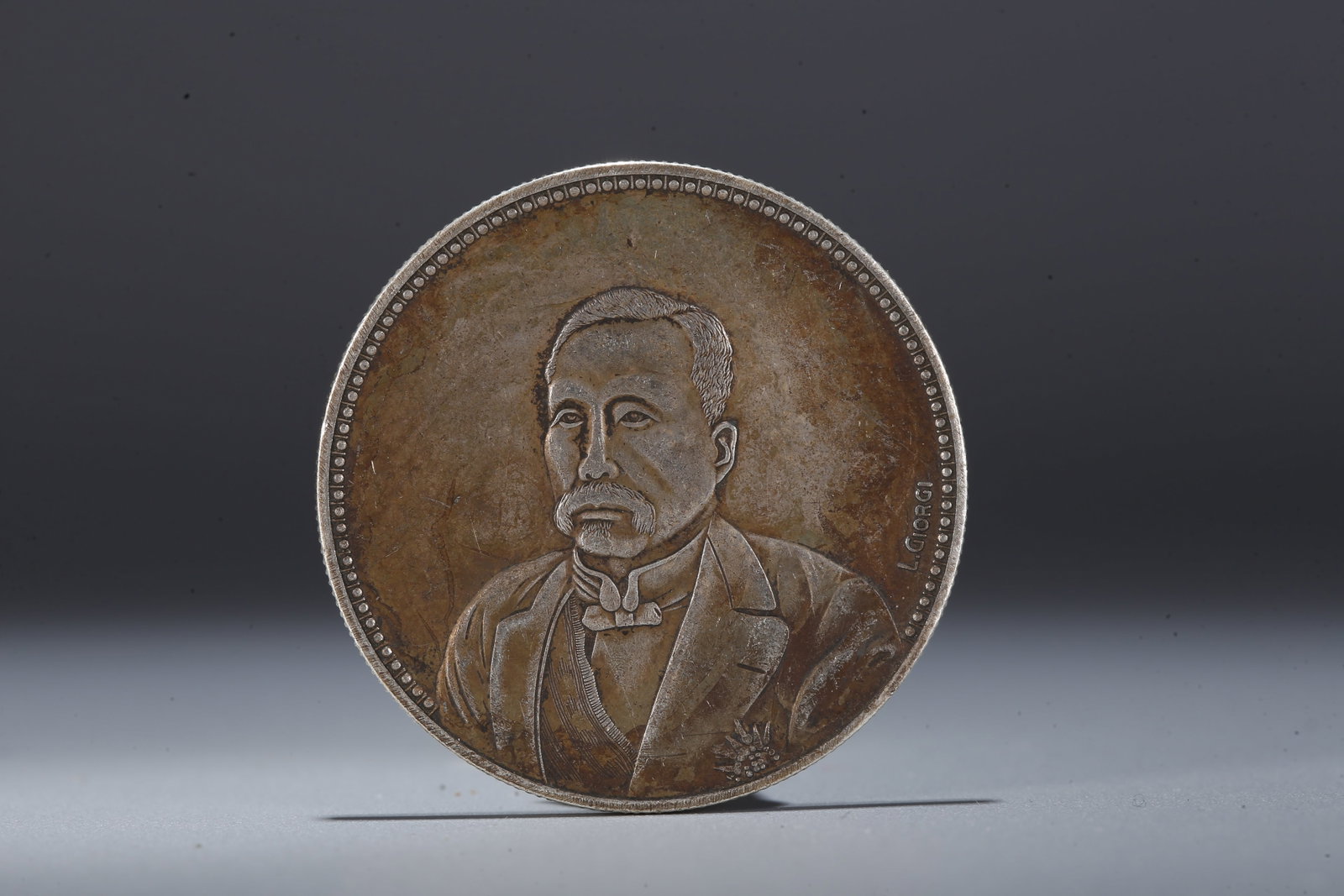 A SILVER DOLLAR COIN - 3