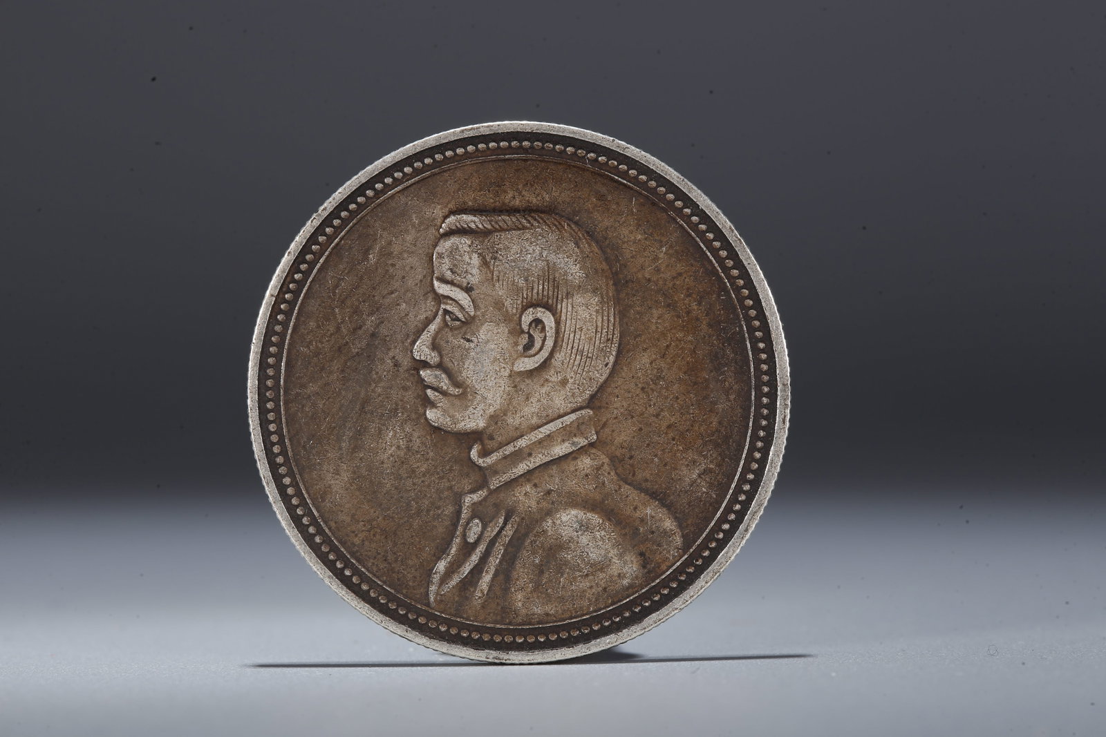 A SILVER DOLLAR COIN - 3