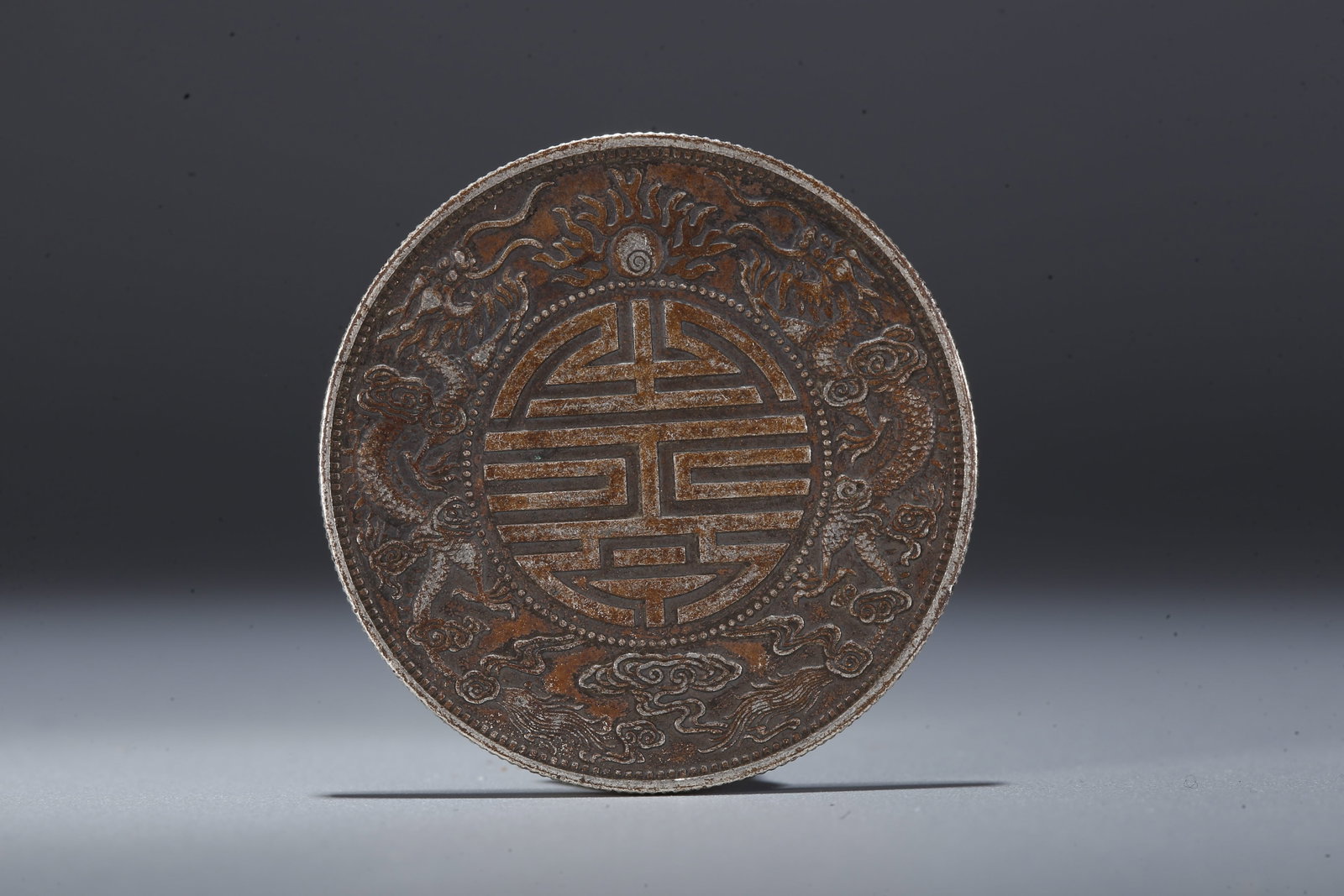 A SILVER DOLLAR COIN - 3