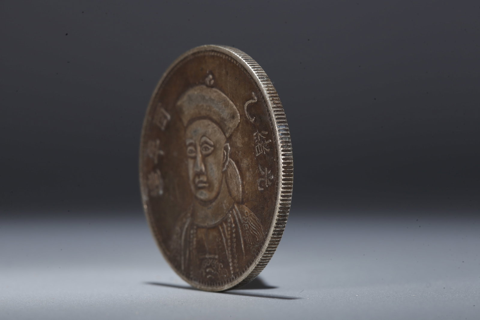 A SILVER DOLLAR COIN - 2