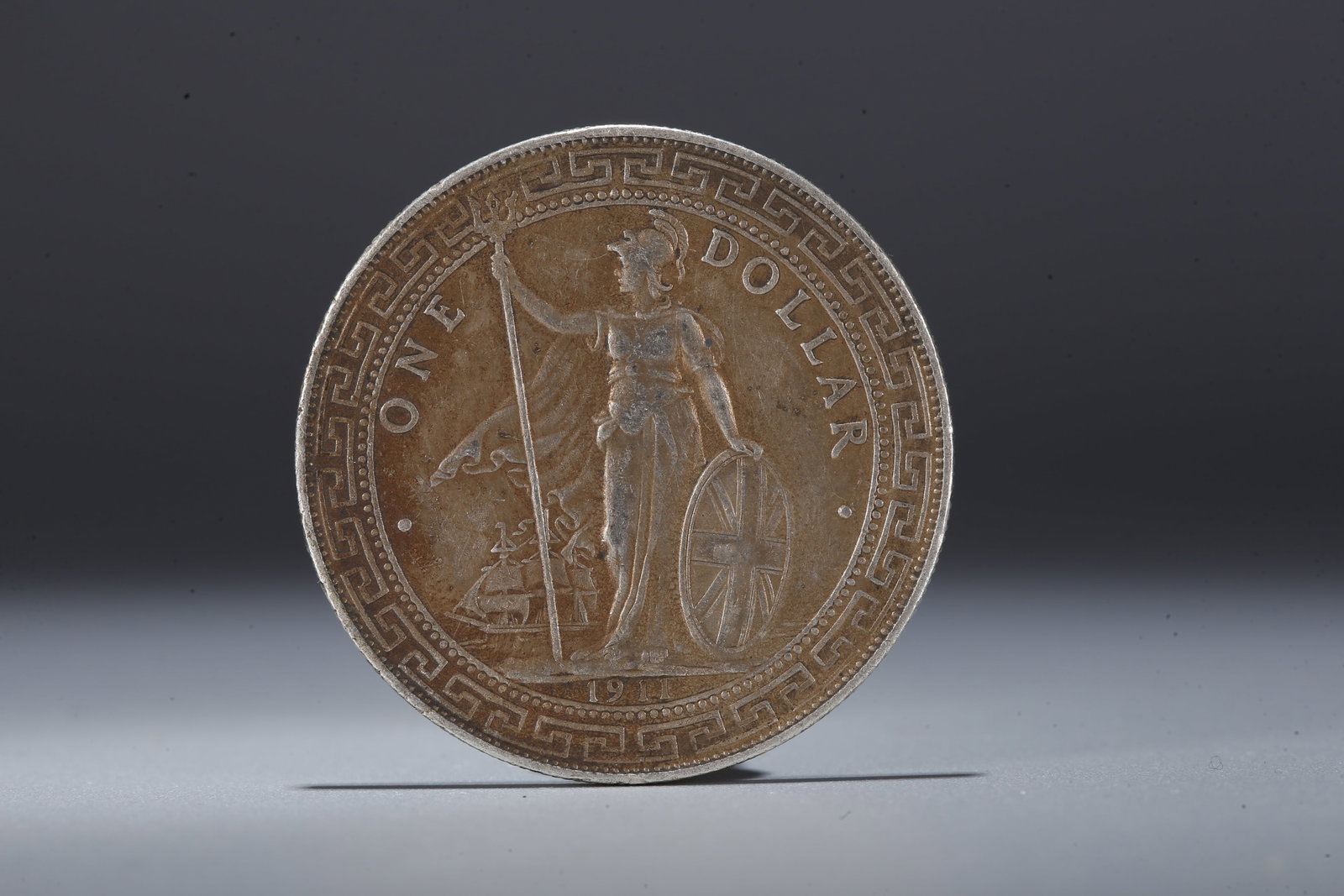 A SILVER DOLLAR COIN - 3