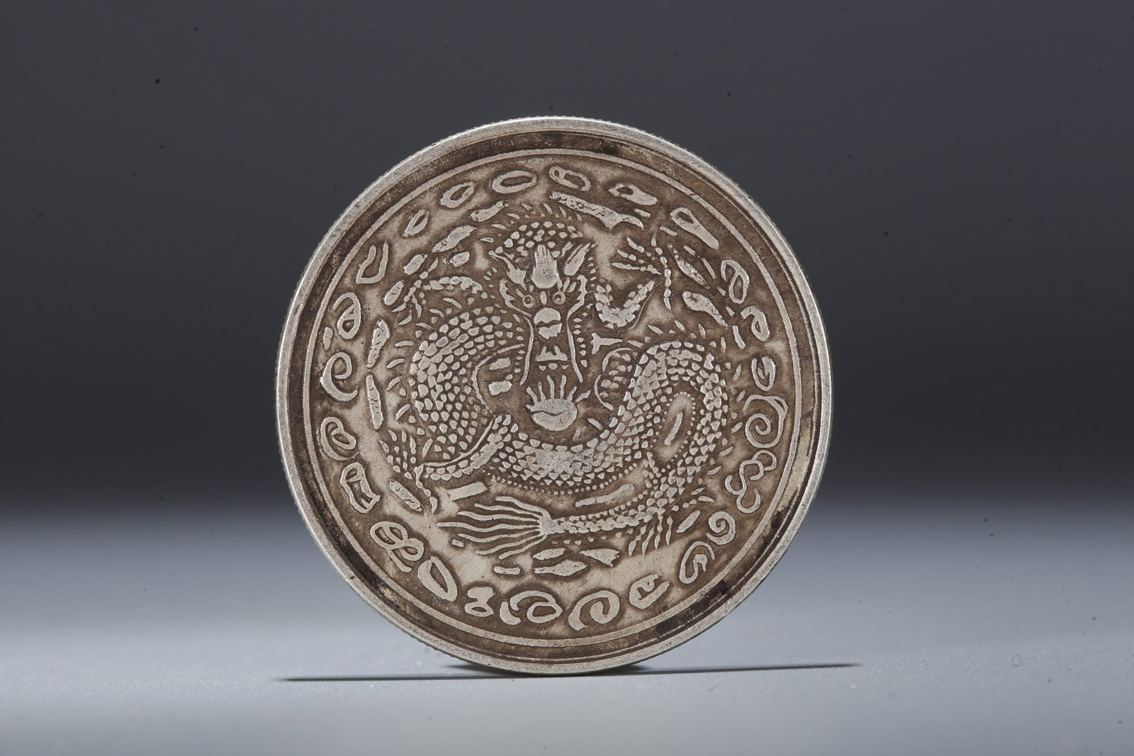 A SILVER DOLLAR COIN - 3