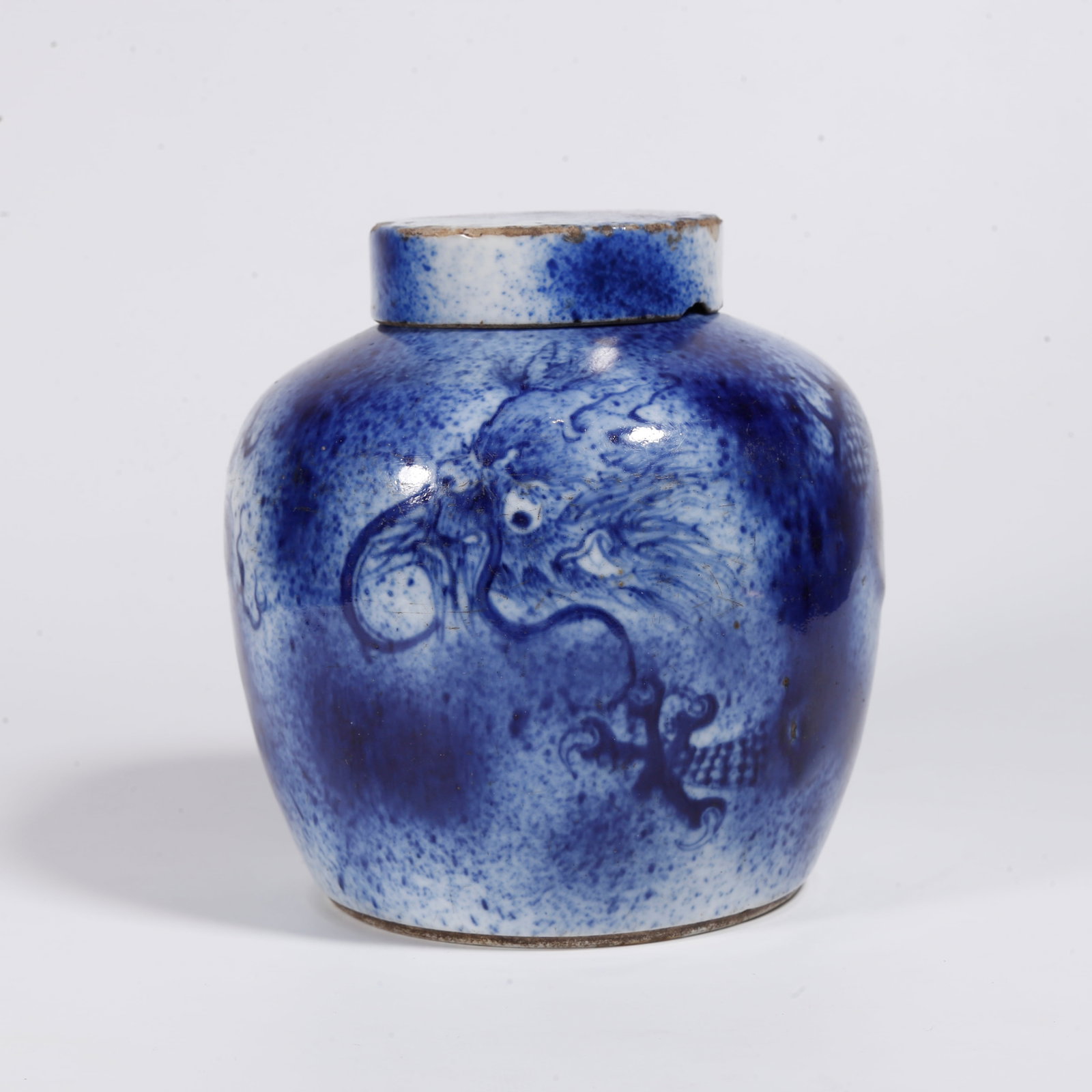 A COVERED BLUE AND WHITE JAR WITH DRAGON AND CLOUD PATTERNS (1 of 10)