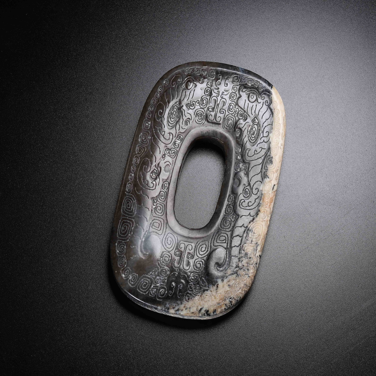 A ANCIENT JADE BI DISC WITH BEAST MASK PATTERN: Ancient Jade Bi Disc with Beast Mask Pattern
