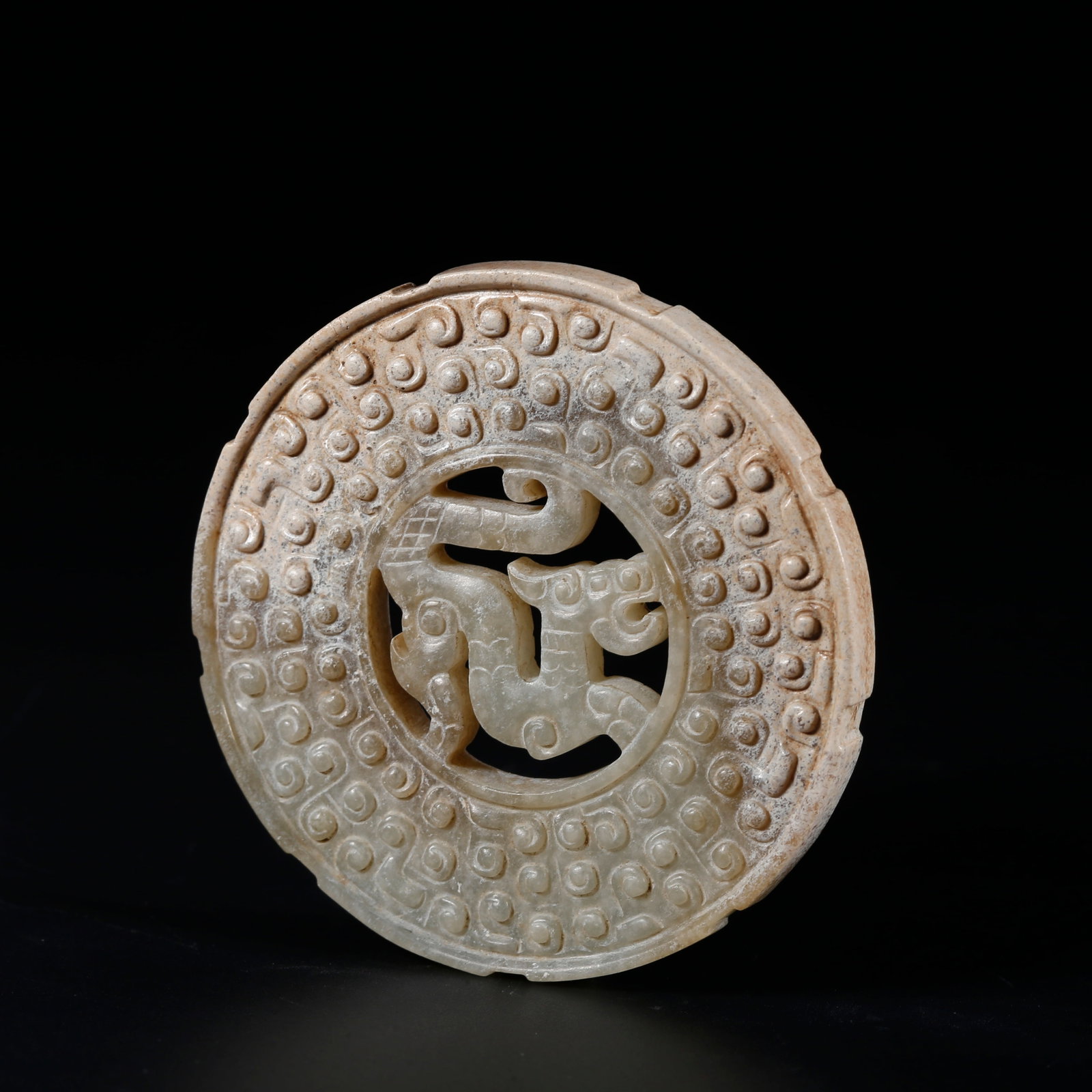 A ARCHAIC JADE BI DISC WITH BEAST MOTIFS: Archaic Jade Bi Disc with Beast Motifs