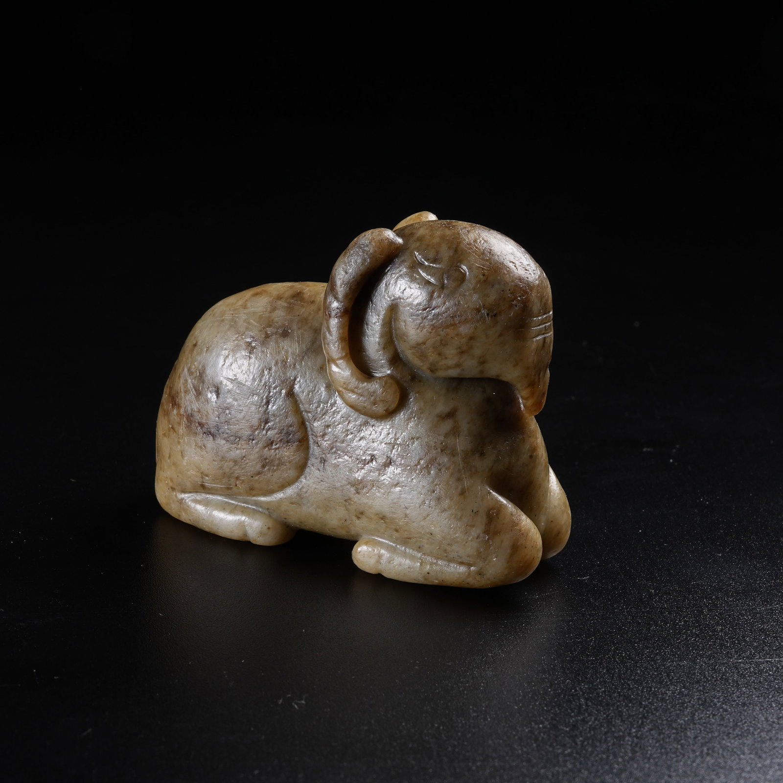 A ANCIENT JADE RECUMBENT SHEEP ORNAMENT: Ancient Jade Recumbent Sheep Ornament