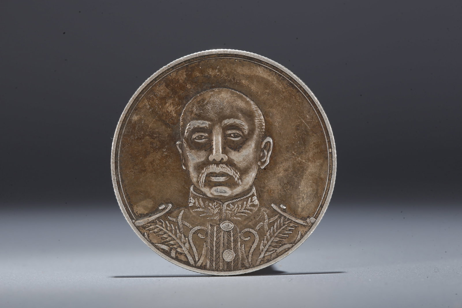 A SILVER DOLLAR COIN - 3