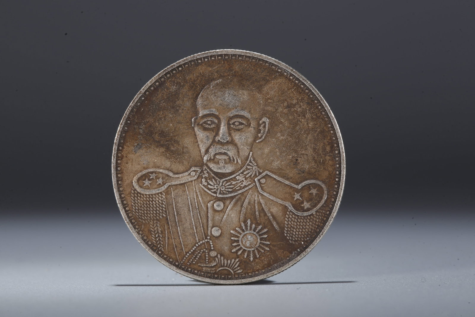 A SILVER DOLLAR COIN - 3