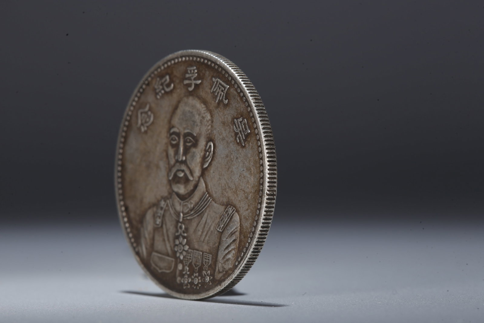 A SILVER DOLLAR COIN - 2