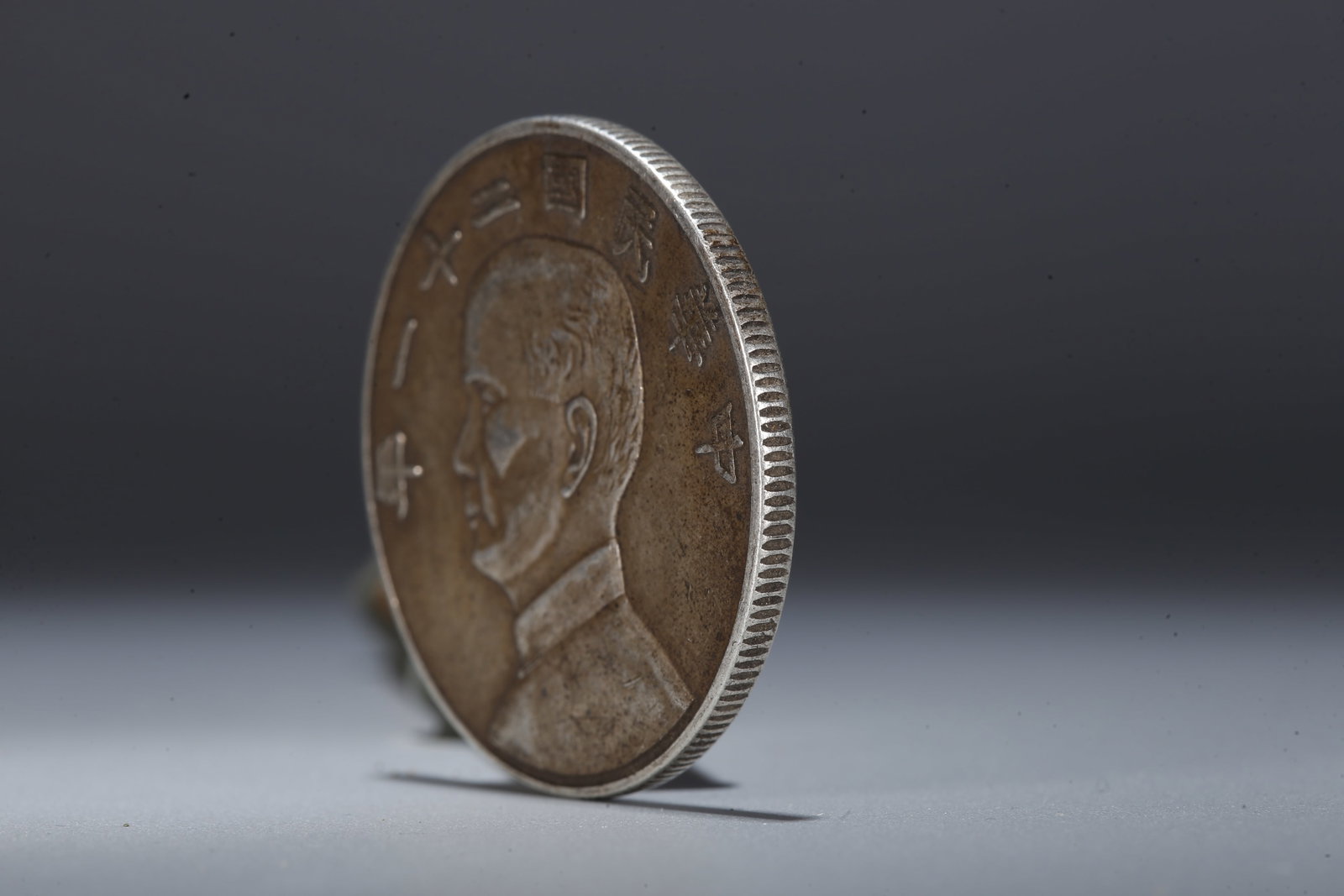 A SILVER DOLLAR COIN - 2