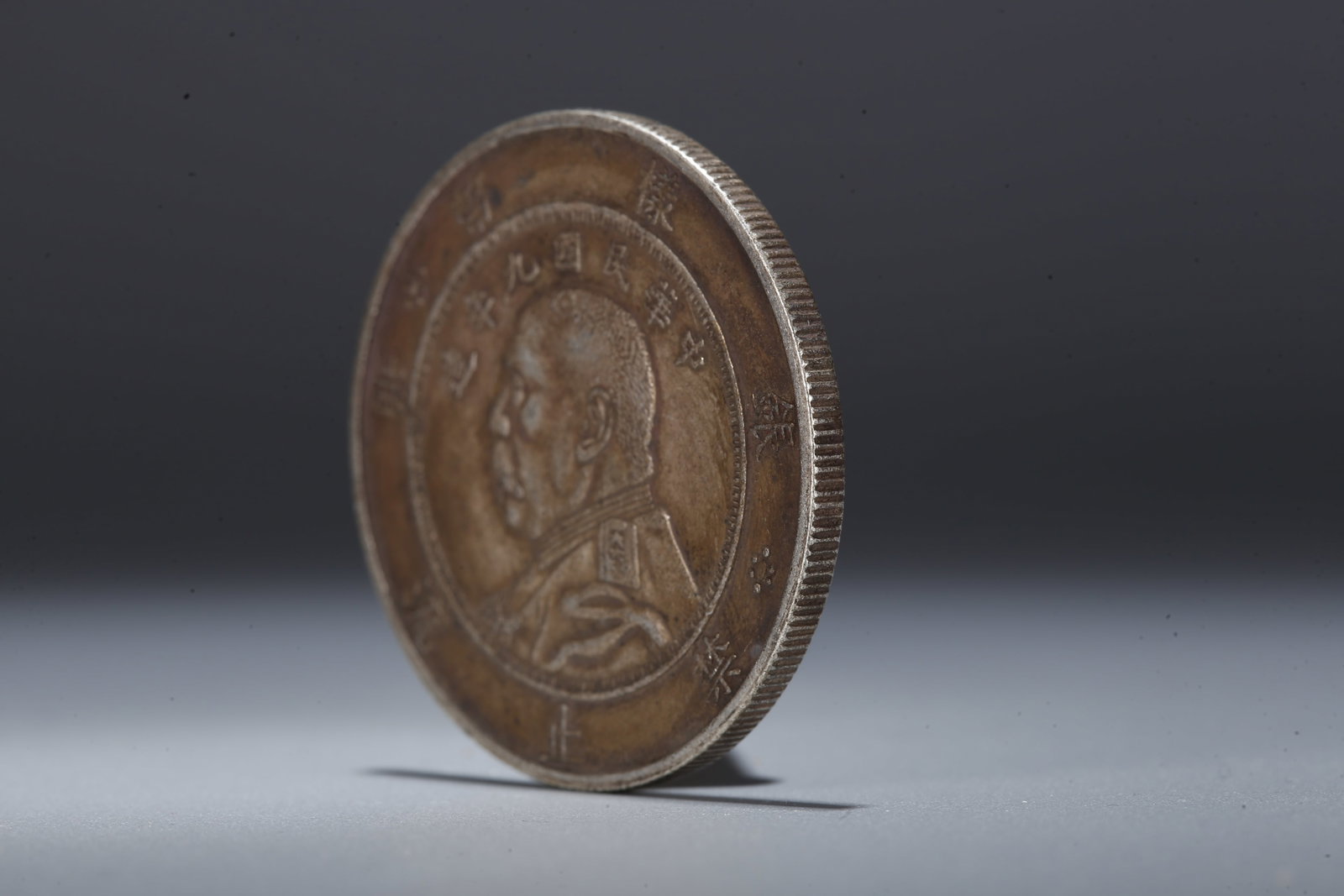 A SILVER DOLLAR COIN - 2