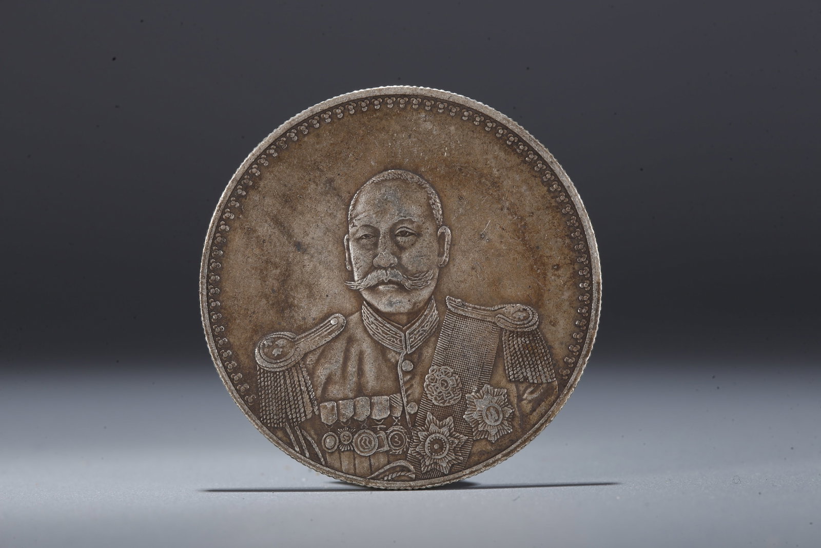 A SILVER DOLLAR COIN - 3