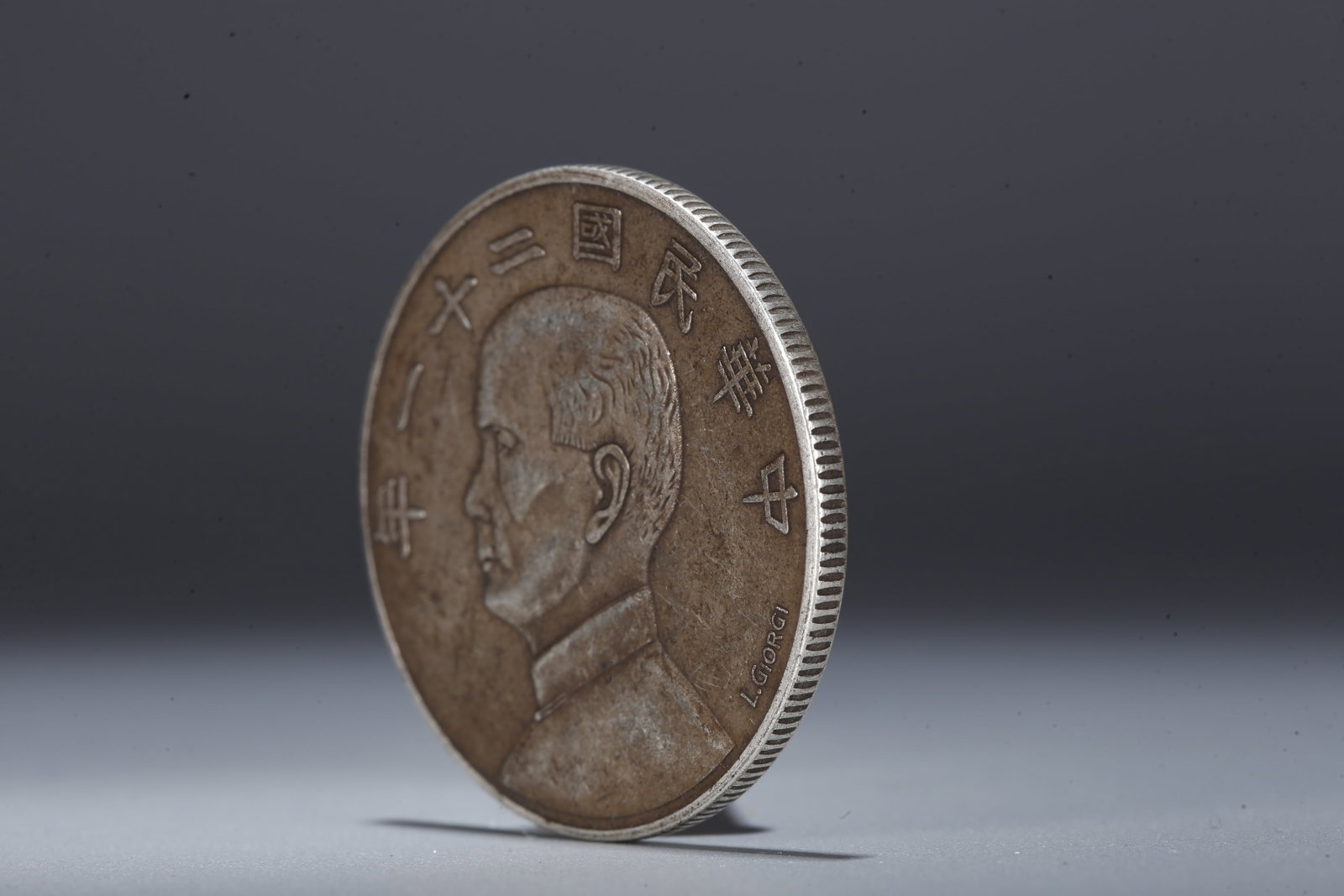 A SILVER DOLLAR COIN - 2