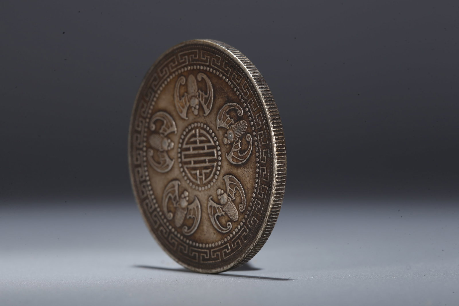 A SILVER DOLLAR COIN - 2