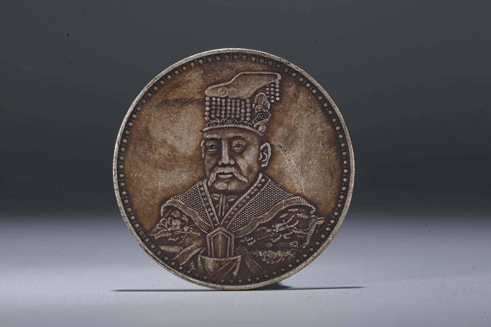 A SILVER DOLLAR COIN - 3