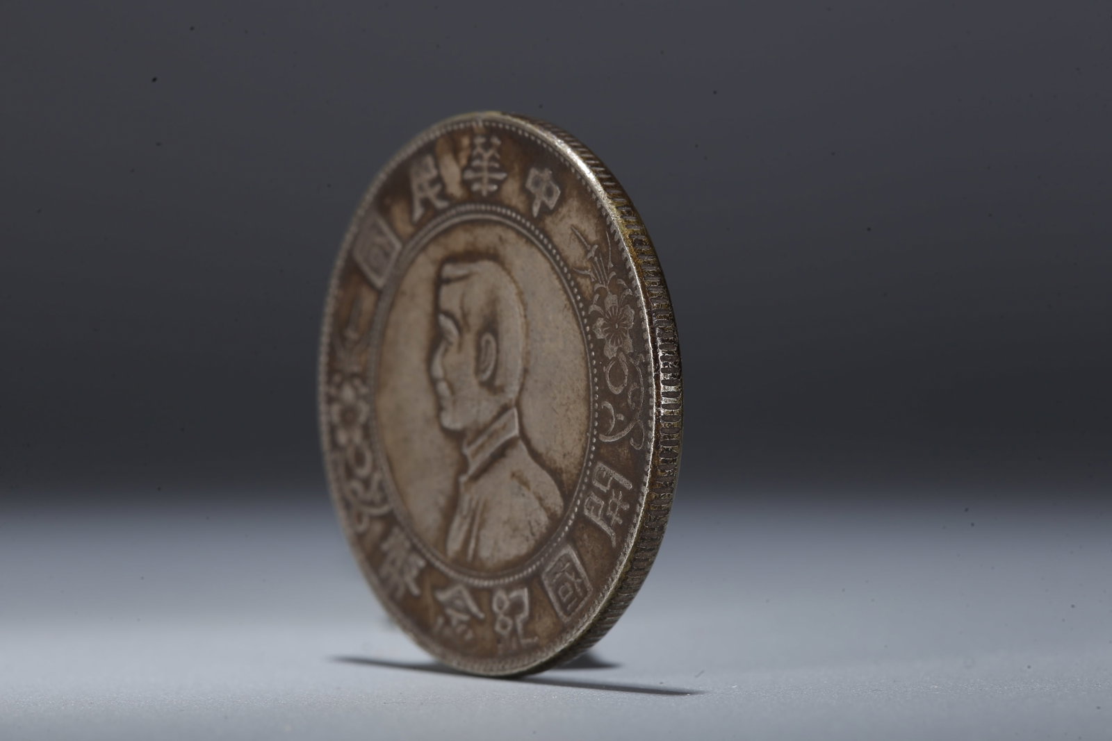 A SILVER DOLLAR COIN - 2