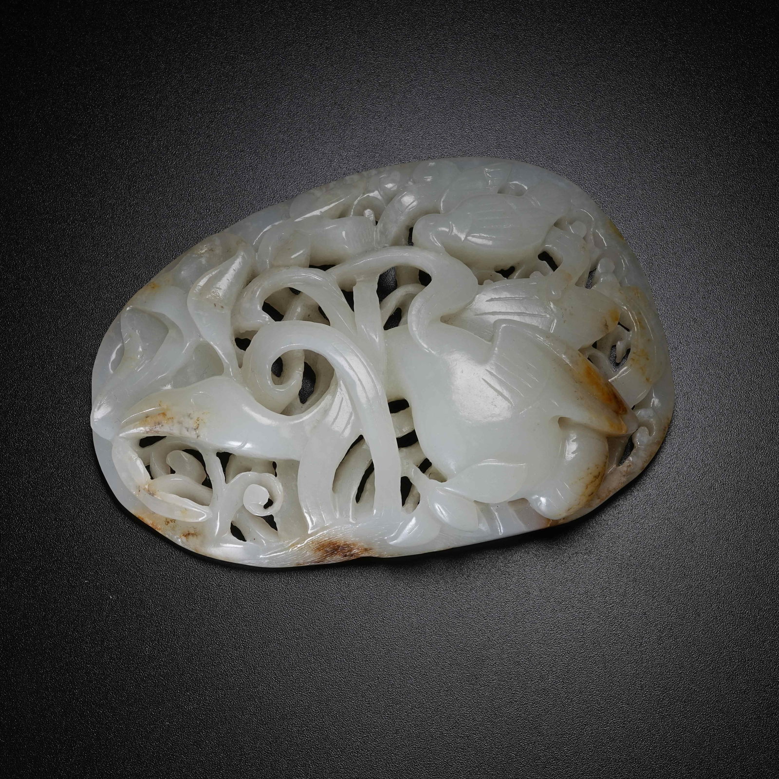A ANCIENT JADE BELT ORNAMENT WITH PHOENIX INTERSPERSED FLORAL PATTERN: Ancient Jade Belt Ornament with Phoenix Interspersed Floral Pattern