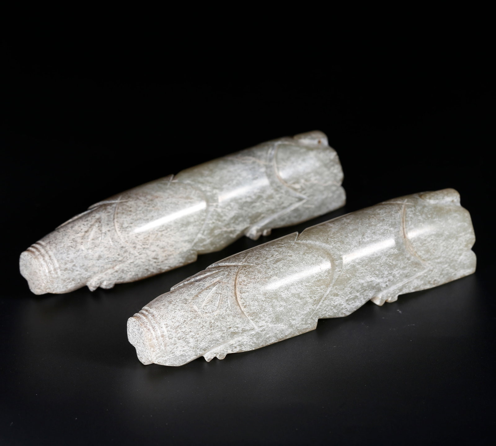 A ARCHAIC JADE PIG-SHAPED HAND REST (A PAIR): Archaic Jade Pig-shaped Hand Rest (A Pair)
