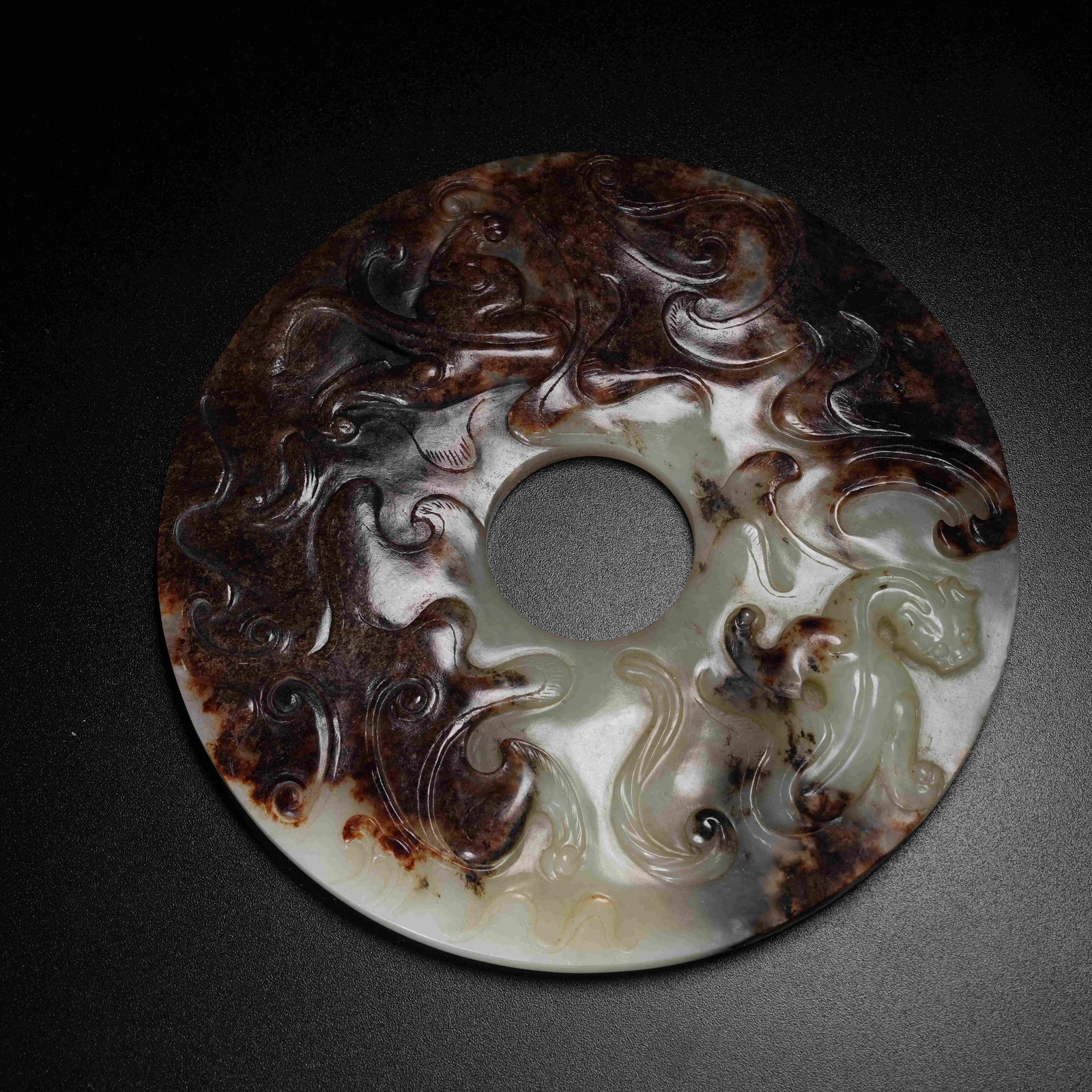 A ANCIENT JADE BI DISC WITH CHI DRAGON PATTERN: Ancient Jade Bi Disc with Chi Dragon Pattern