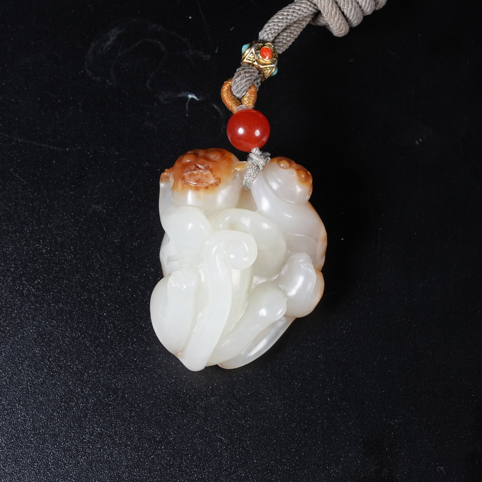 A HETIAN JADE SPIRIT MONKEY PENDANT (1 of 7)
