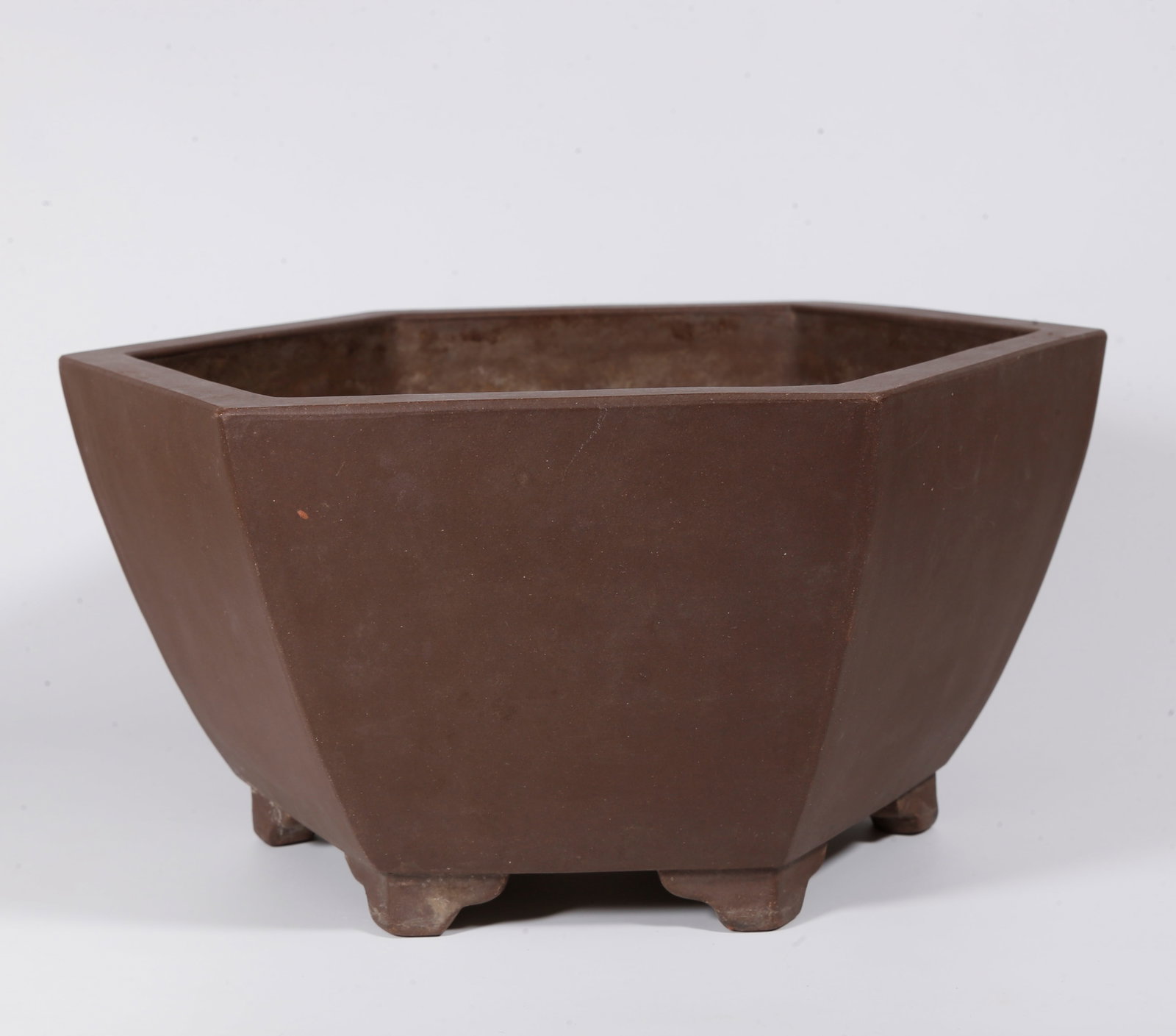 A HEXAGONAL PURPLE CLAY FLOWER POT (1 of 10)
