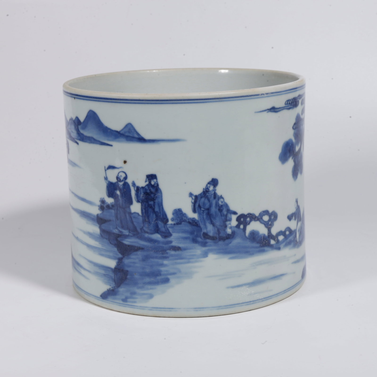 A BLUE AND WHITE BRUSH POT WITH NARRATIVE FIGURE SCENES: Blue and White Brush Pot with Narrative Figure Scenes