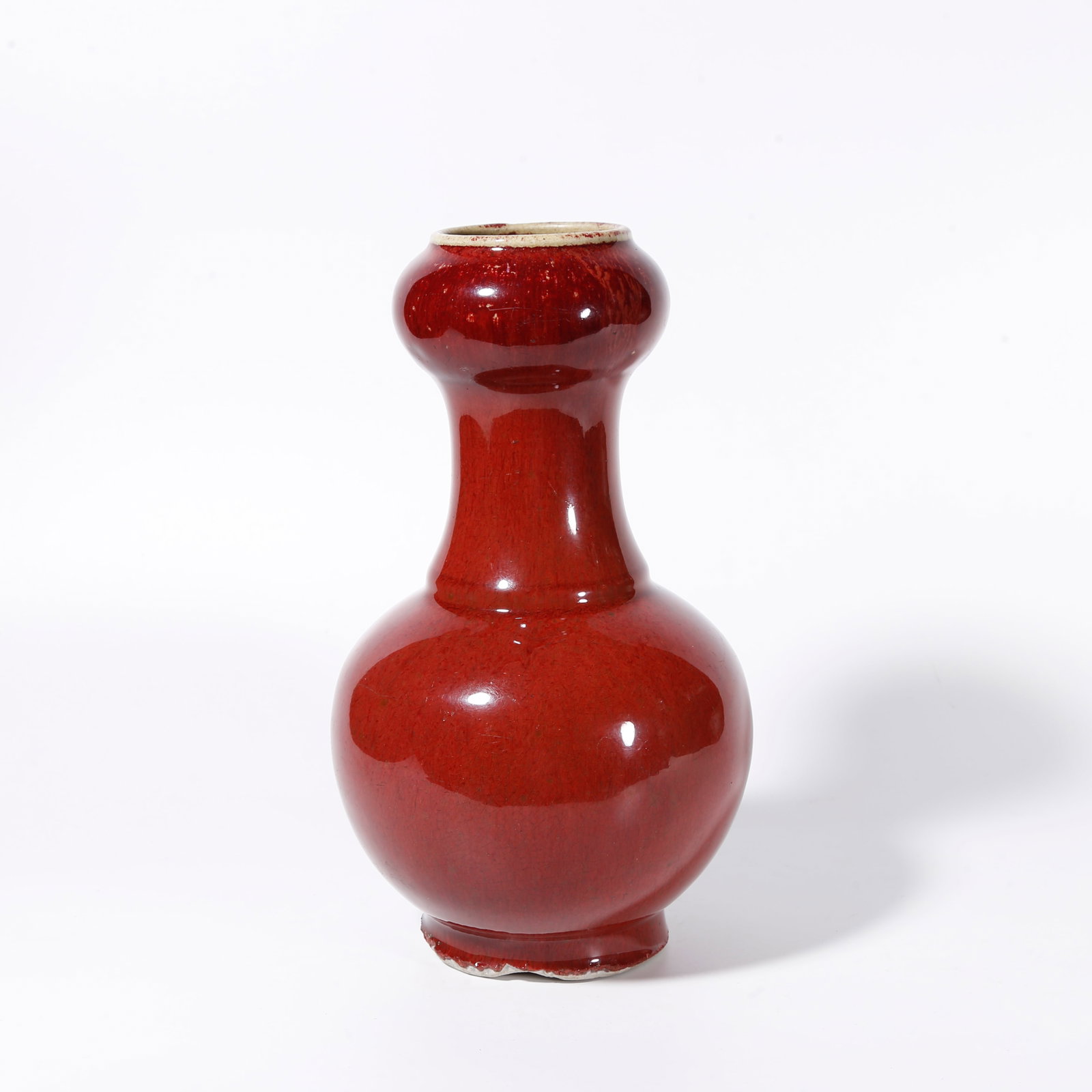 A RED GLAZE GARLIC HEAD VASE: Red Glaze Garlic Head Vase