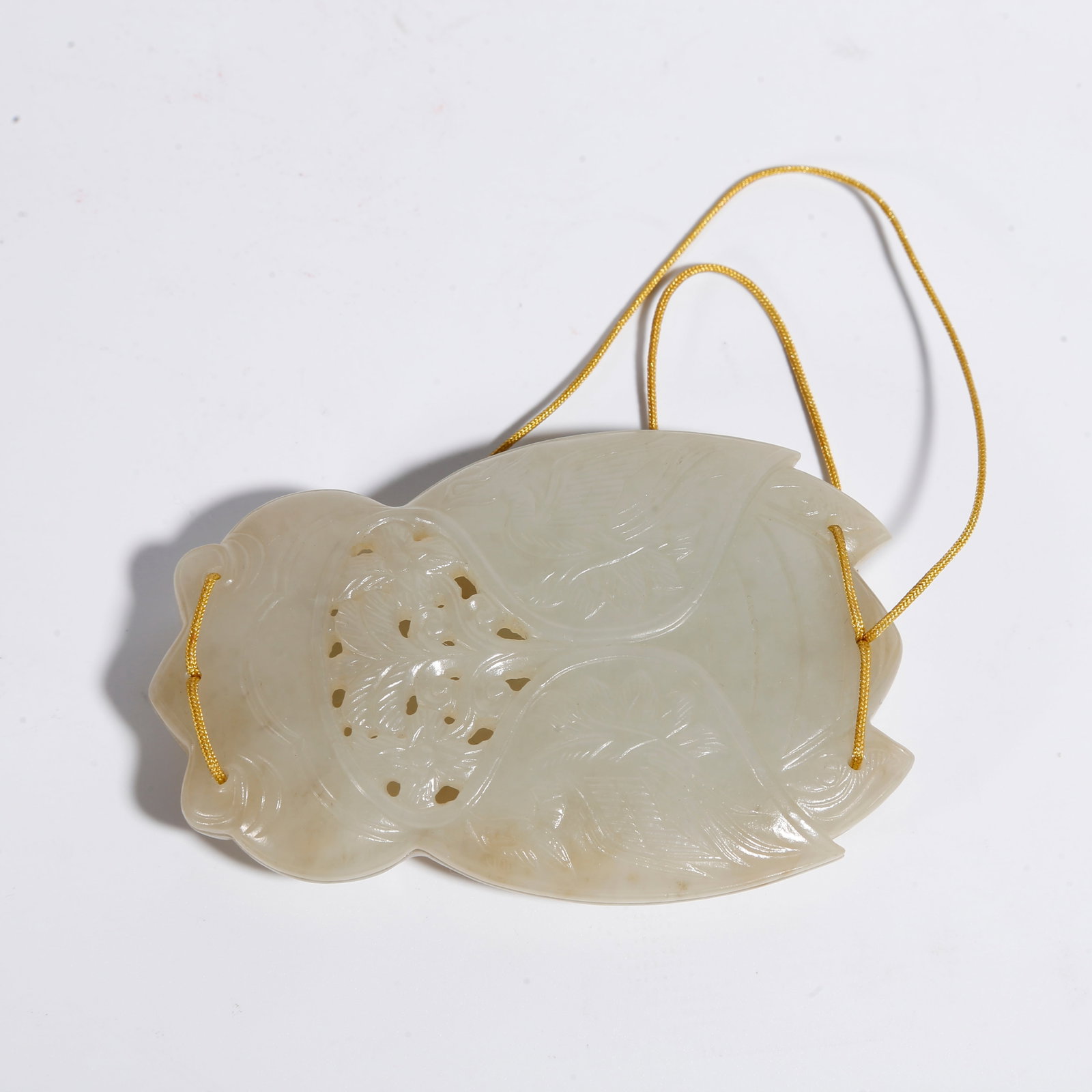 A HETIAN JADE SACHET CARVED WITH INSECT PATTERNS (1 of 9)