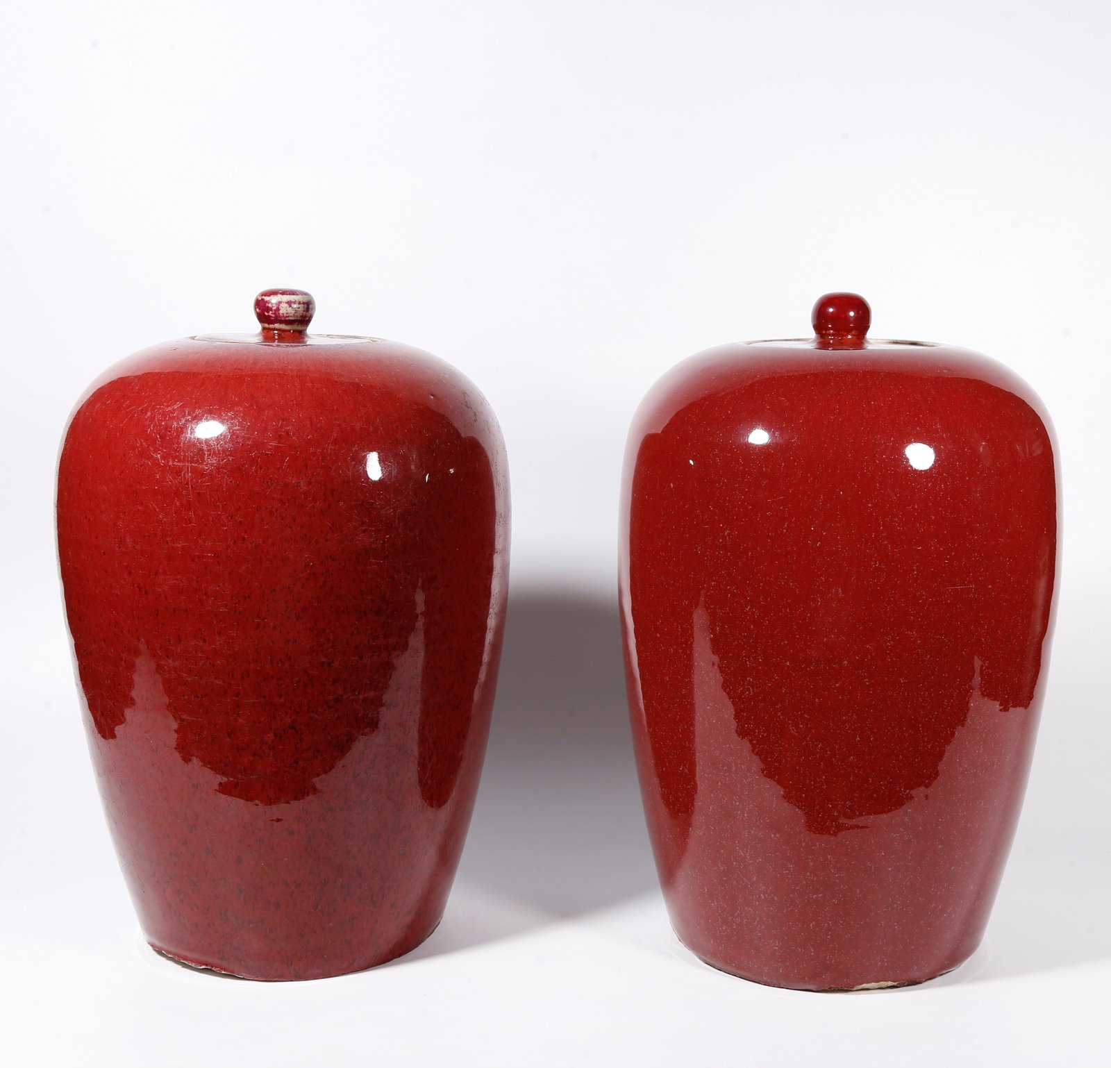 A PAIR OF RED GLAZE COVERED JARS (1 of 9)