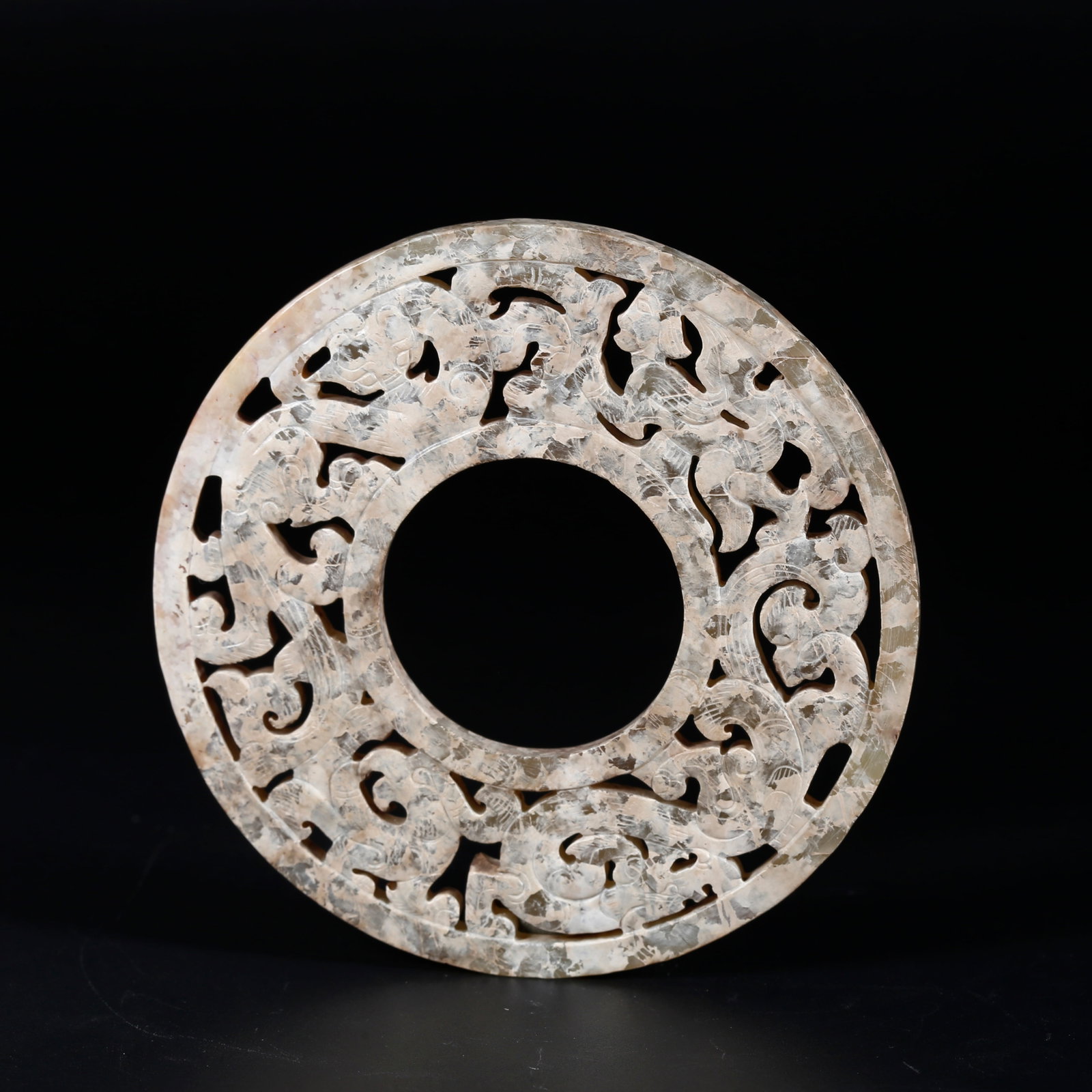 A ARCHAIC JADE BI DISC WITH DRAGON PATTERNS: Archaic Jade Bi Disc with Dragon Patterns