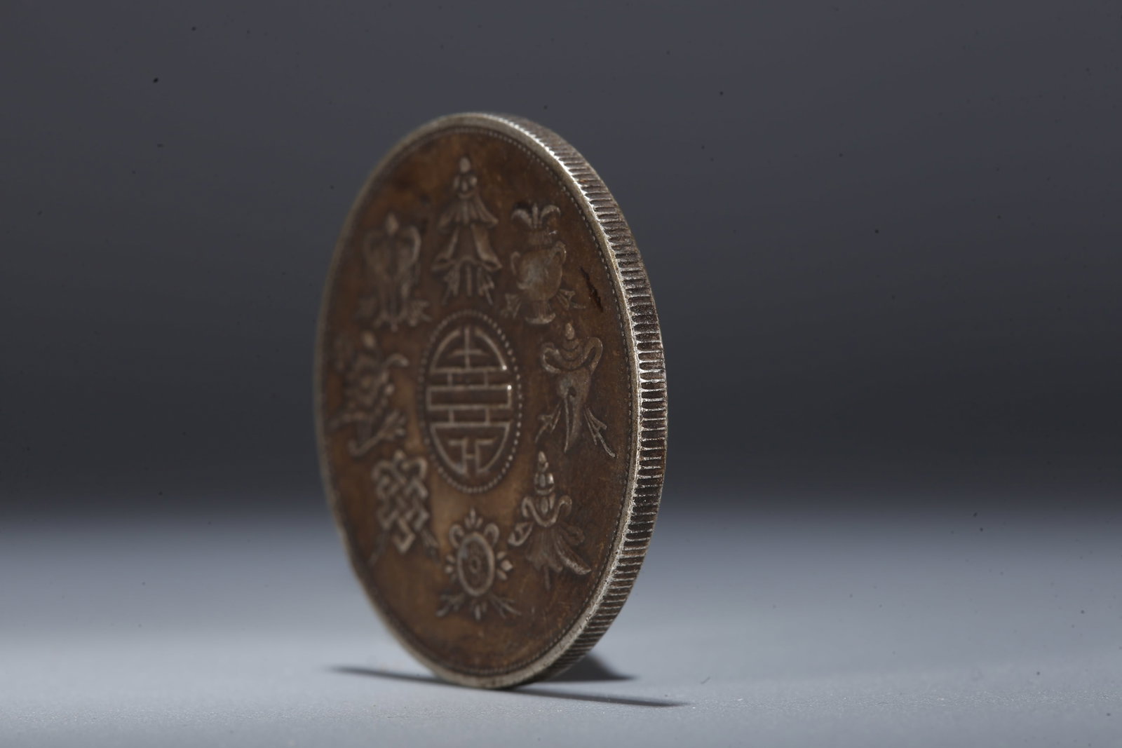 A SILVER DOLLAR COIN - 2