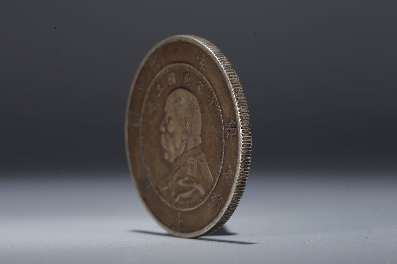 A SILVER DOLLAR COIN - 2