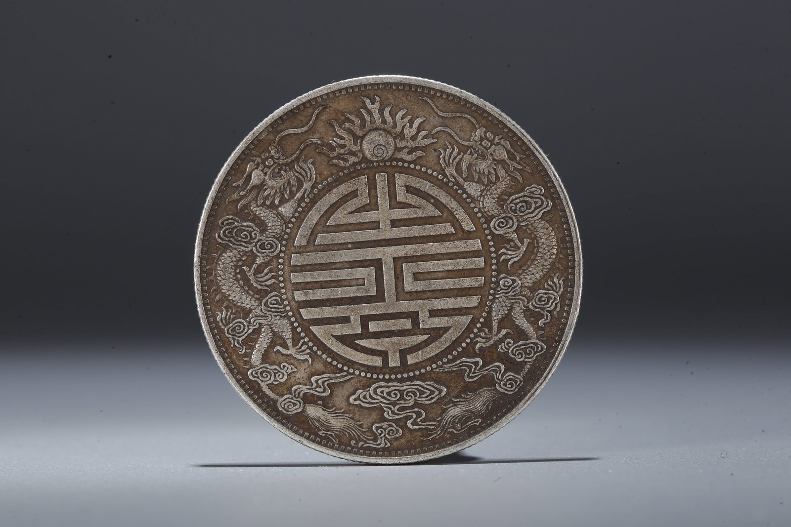 A SILVER DOLLAR COIN - 3
