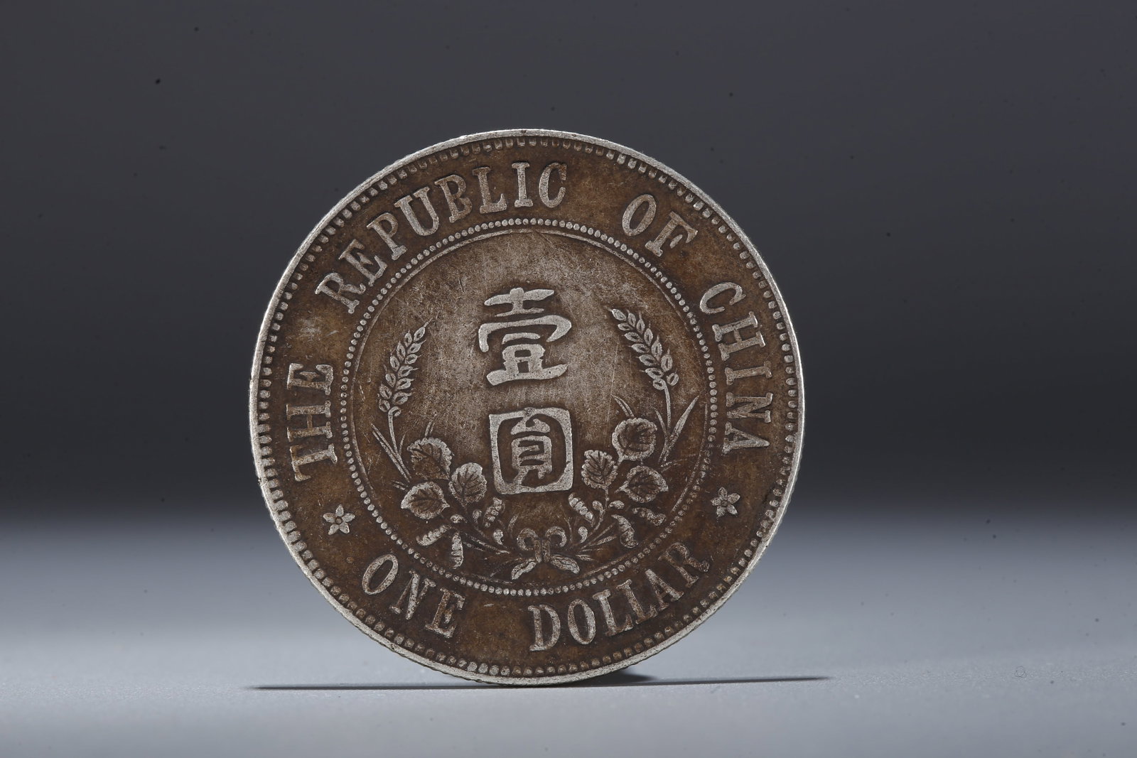 A SILVER DOLLAR COIN - 3