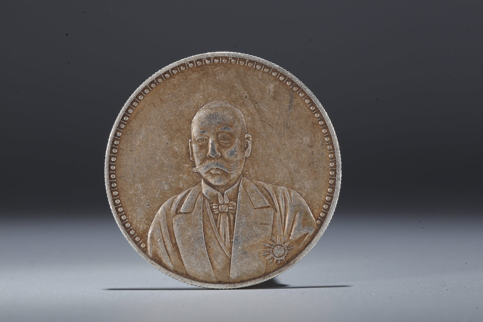 A SILVER DOLLAR COIN - 3