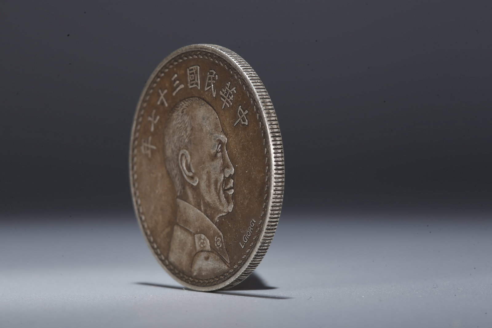 A SILVER DOLLAR COIN - 2