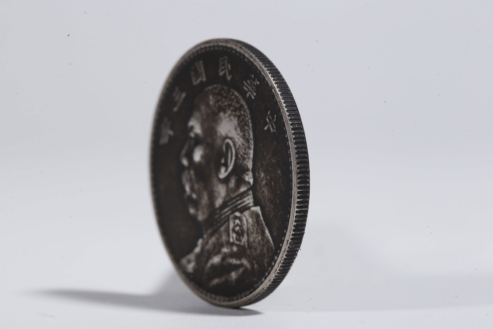 A SILVER DOLLAR COIN - 2