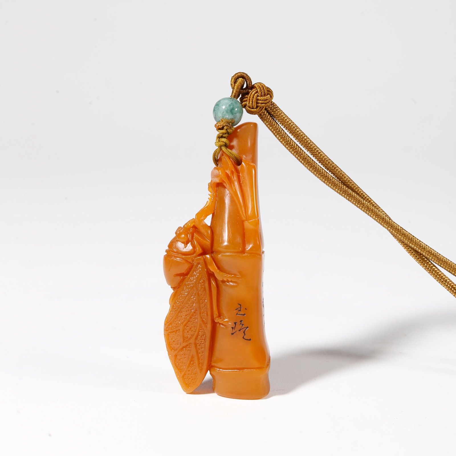 A SHOUSHAN TIANHUANG STONE PENDANT CARVED WITH INSECT AND BAMBOO MOTIFS (1 of 9)