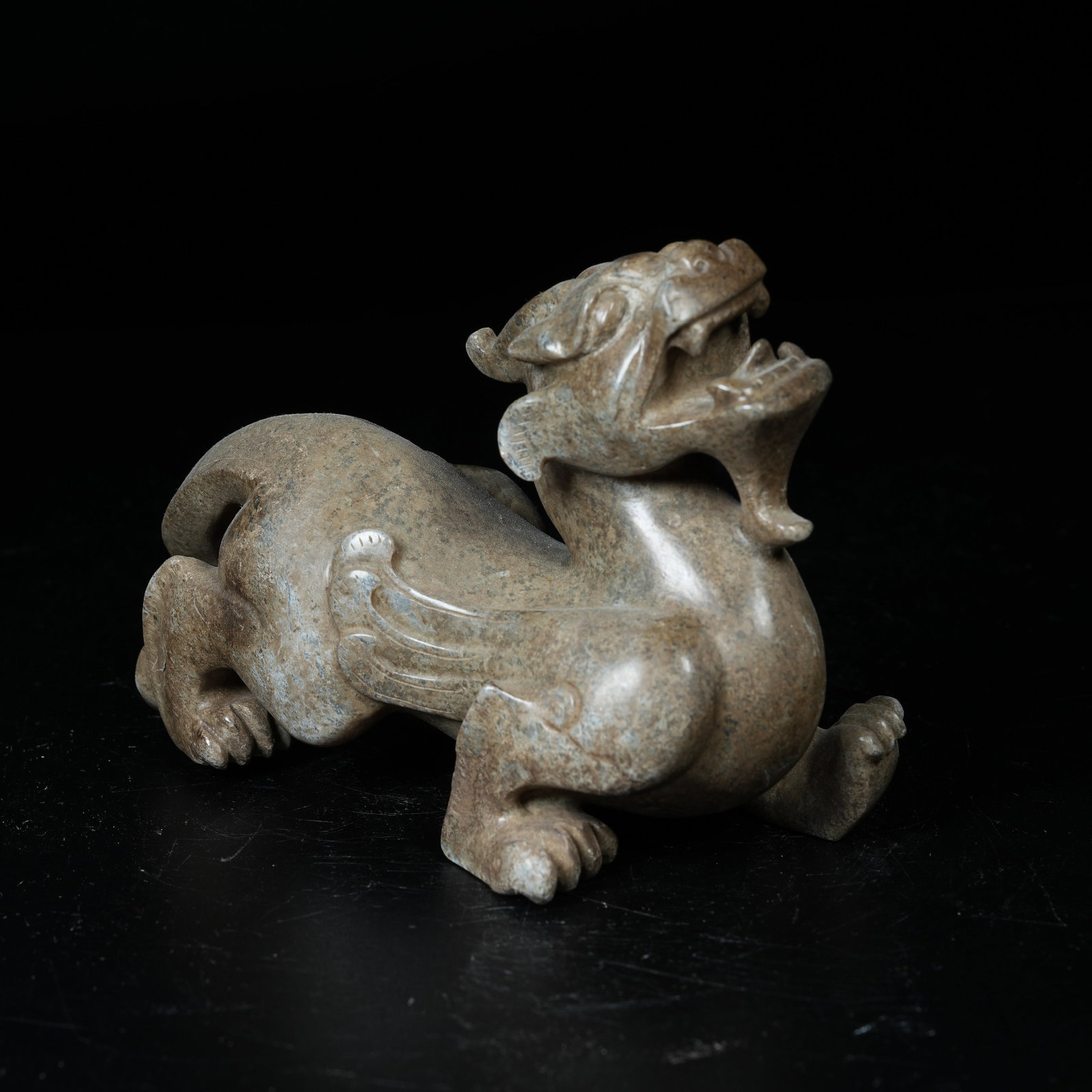 A ARCHAIC JADE AUSPICIOUS BEAST ORNAMENT: Archaic Jade Auspicious Beast Ornament