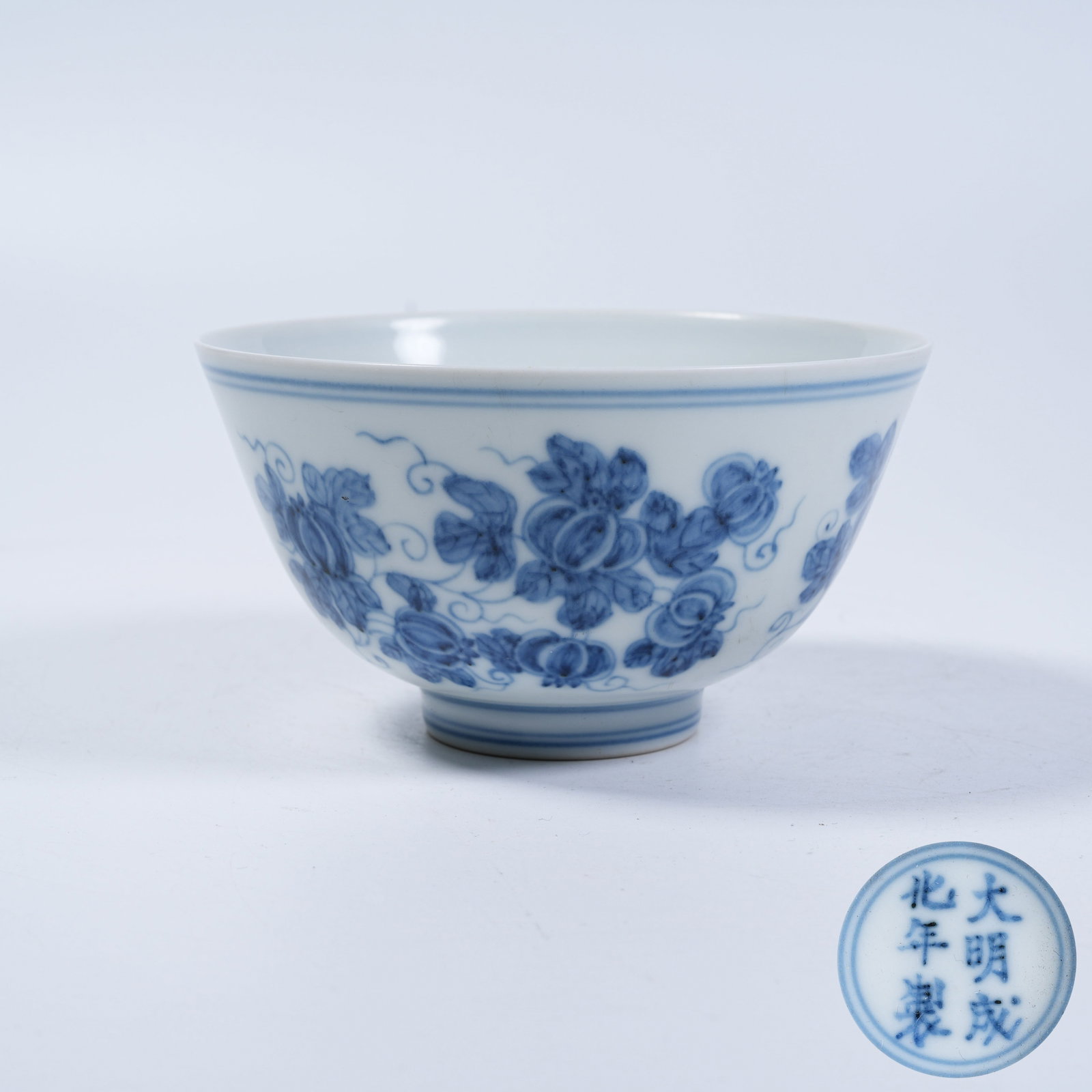 A CUP WITH BLUE AND WHITE FLORAL PATTERNS: Cup with Blue and White Floral Patterns