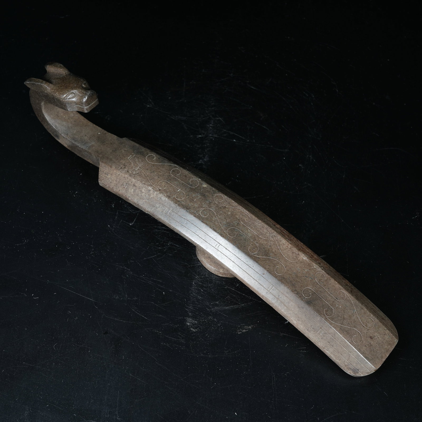 A ARCHAIC JADE BELT HOOK WITH DRAGON HEAD: Archaic Jade Belt Hook with Dragon Head